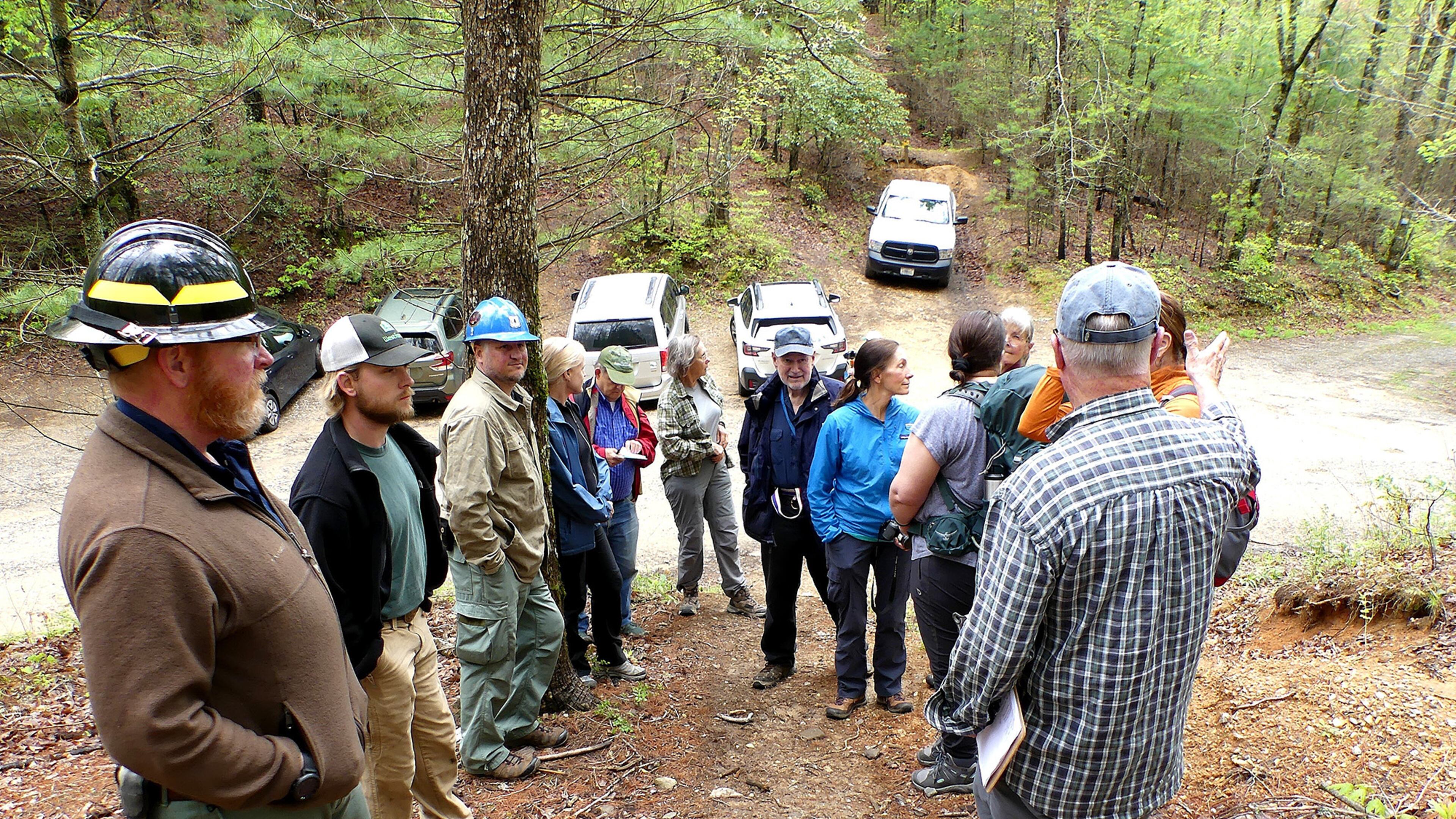 Members of the Georgia Botanical Society meet with U.S. Forest Service personnel to discuss the use of prescribed burning at Mulky Gap in the Chattahoochee National Forest in Union County. A "prescribed fire" two years ago burned hundreds of blooming pink lady's slippers. (Charles Seabrook for The Atlanta Journal-Constitution)