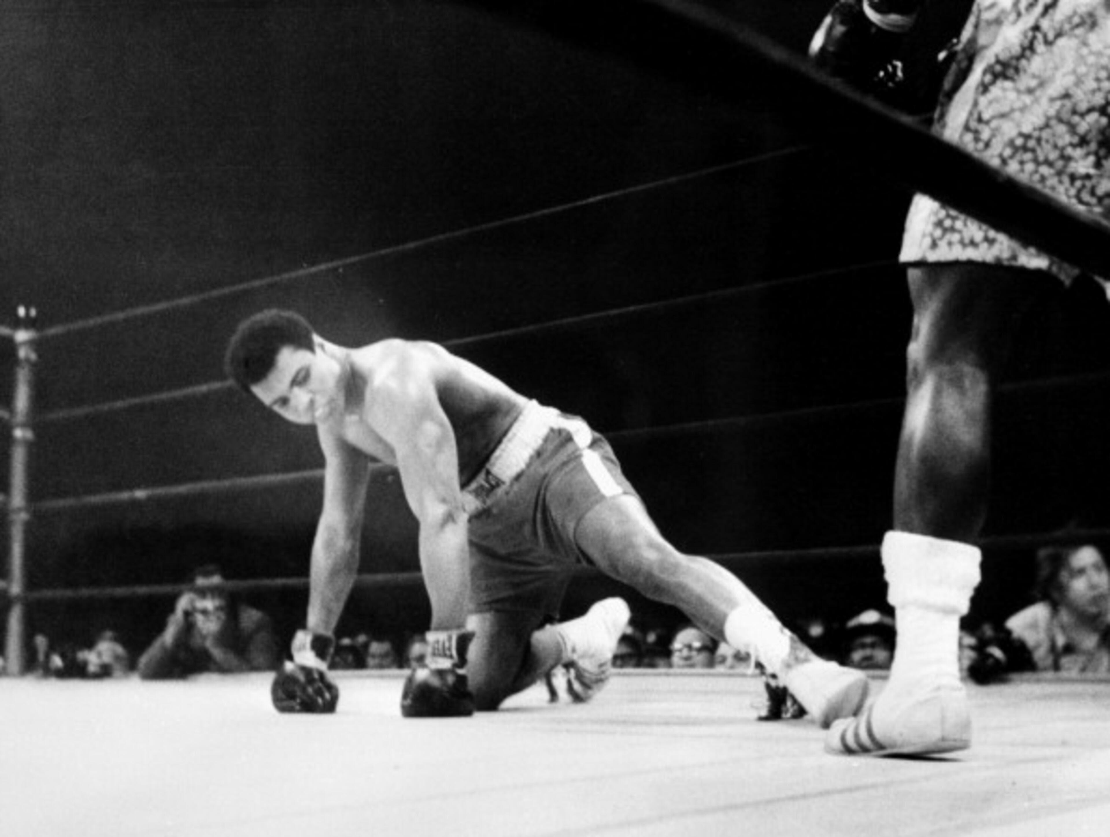 A picture taken March 08 1971 in New York at the Madison Square Garden of the heavyweight boxing world championship fight between Muhammad Ali (Cassius Clay) (on the floor) and Joe Fazier at the end of which Frazier kept his title of heavyweight boxing world champion. (Photo credit should read -/AFP/Getty Images)