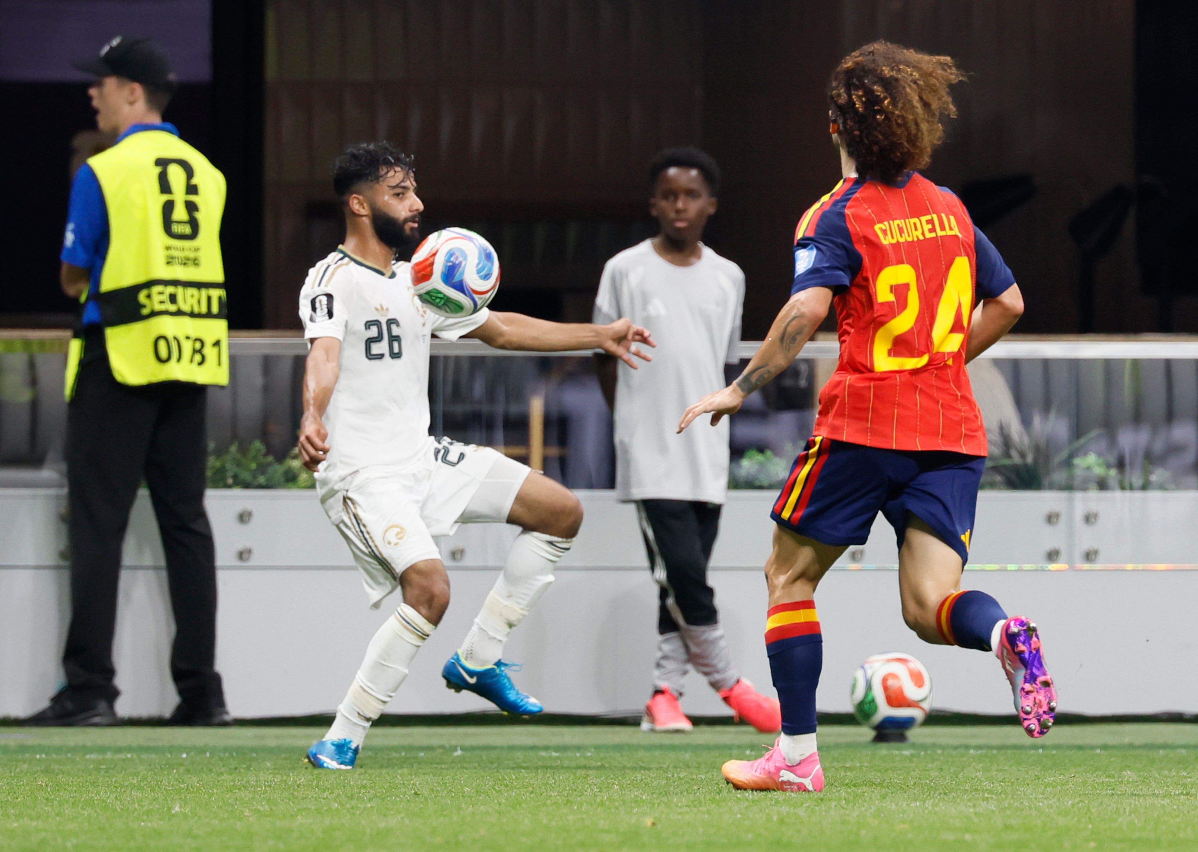 Saudi Arabia's Mohammed Abu Al-Shamat (left) controls the ball against Spain's Marc Cucurella during the second half of the Spain vs. Saudi Arabia World Cup match Sunday, June 21, 2026, at Atlanta Stadium. (Miguel Martinez/AJC)