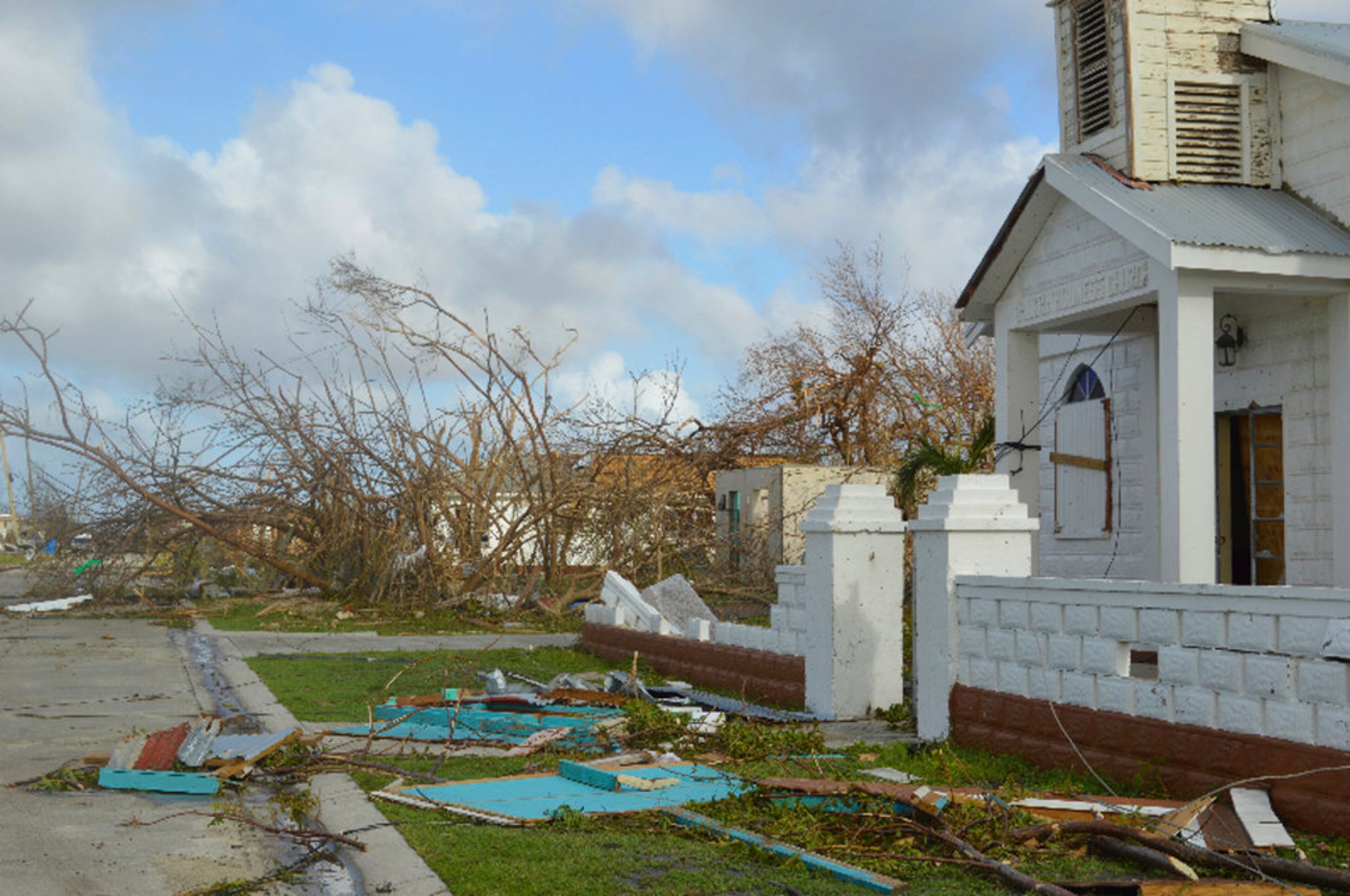 In this Thursday, Sept. 7, 2017, photo, damage is left after Hurricane Irma hit Barbuda. Hurricane Irma battered the Turks and Caicos Islands early Friday as the fearsome Category 5 storm continued a rampage through the Caribbean that has killed a number of people, with Florida in its sights. (AP Photo/Anika E. Kentish)