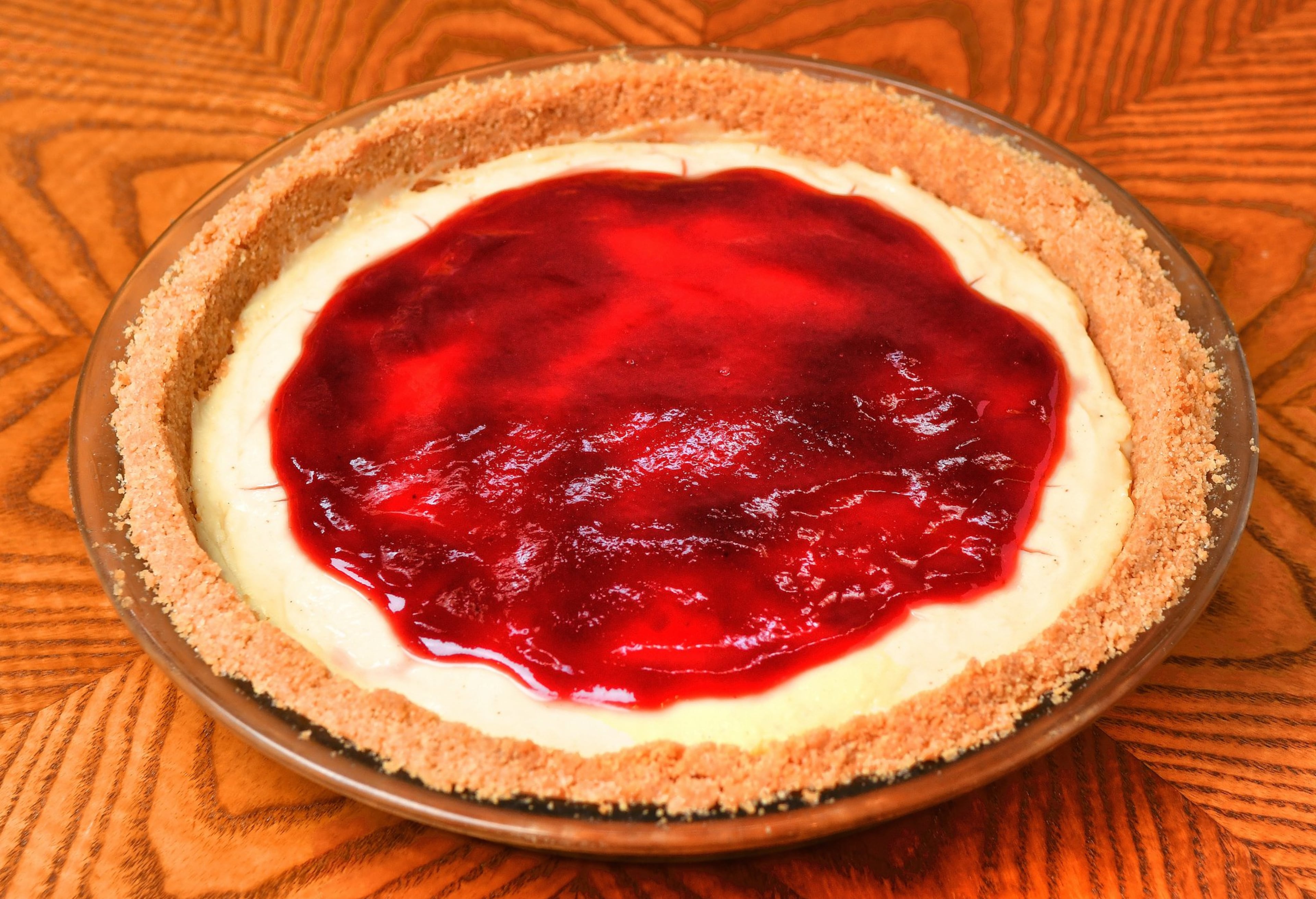 You’ll top your Jelly Doughnut Cream Pie with raspberry jam or preserves. Inside your pie will be nutmeg and vanilla flavors. STYLING BY PAUL ARGUIN AND CHRIS TAYLOR / CONTRIBUTED BY CHRIS HUNT PHOTOGRAPHY
