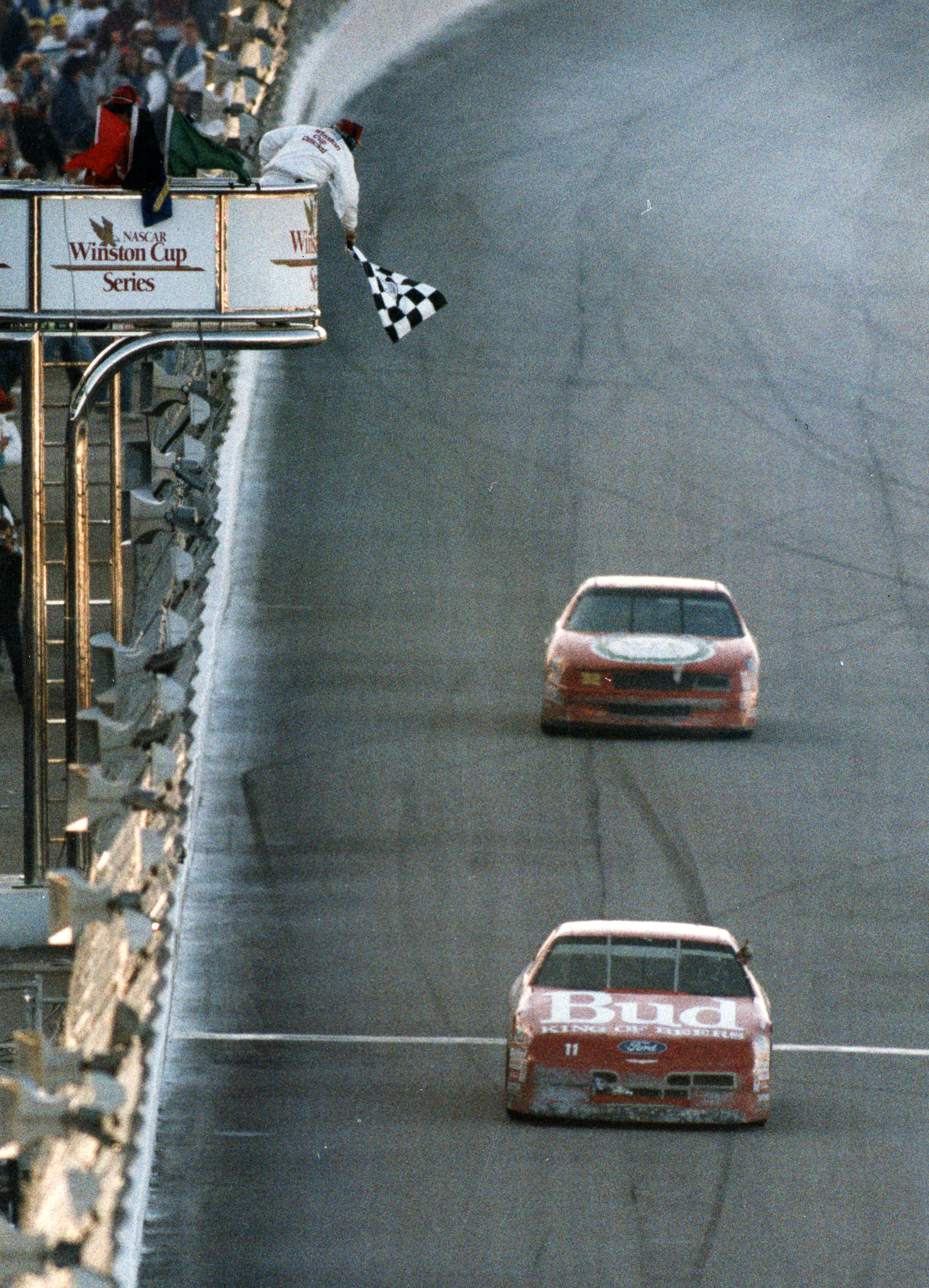Bill Elliott crosses the finish line to conclude the Hooters 500 in 1992.