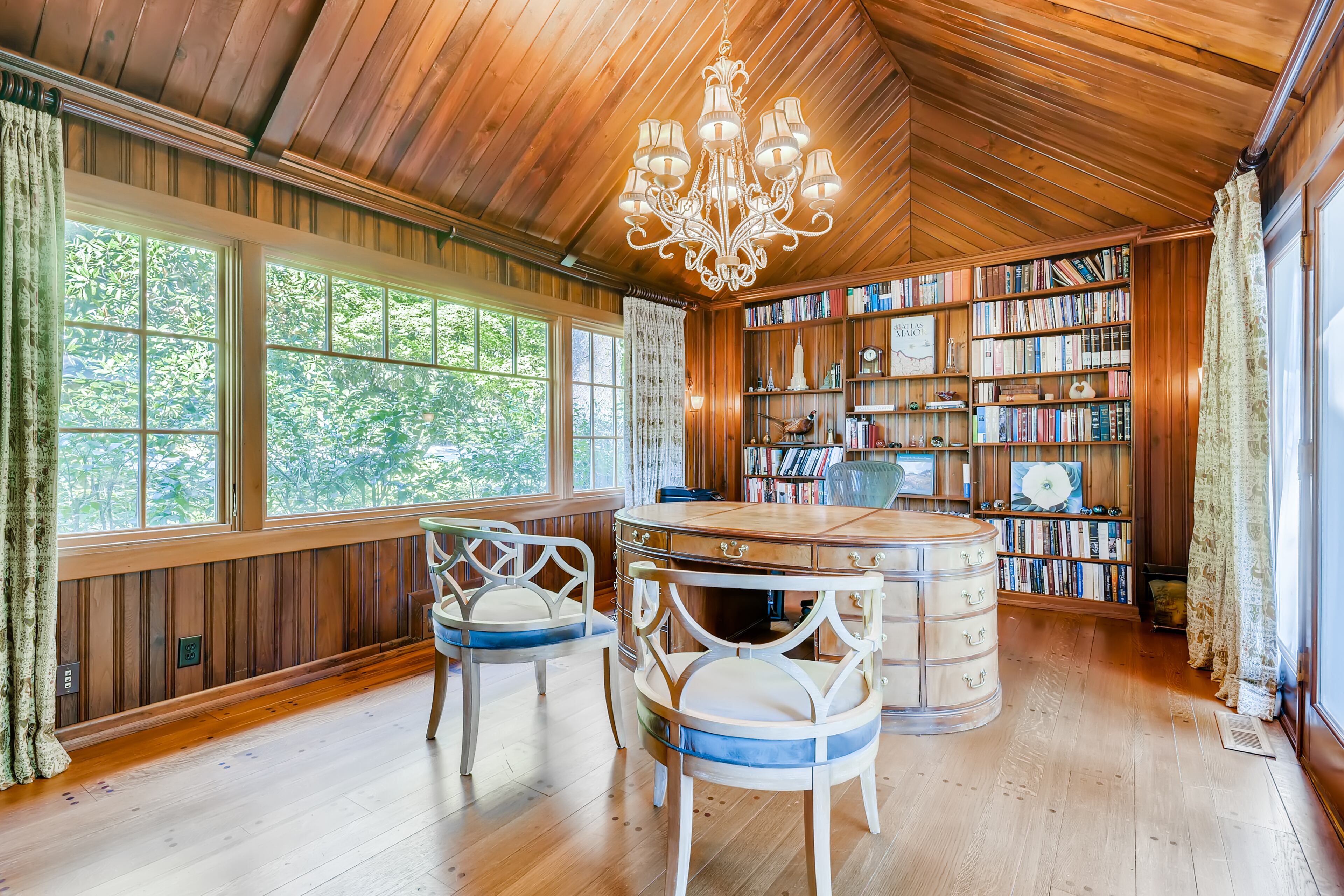 The office is completely paneled in walnut and opens to the terrace at the back of the house. Text by Jean Bird