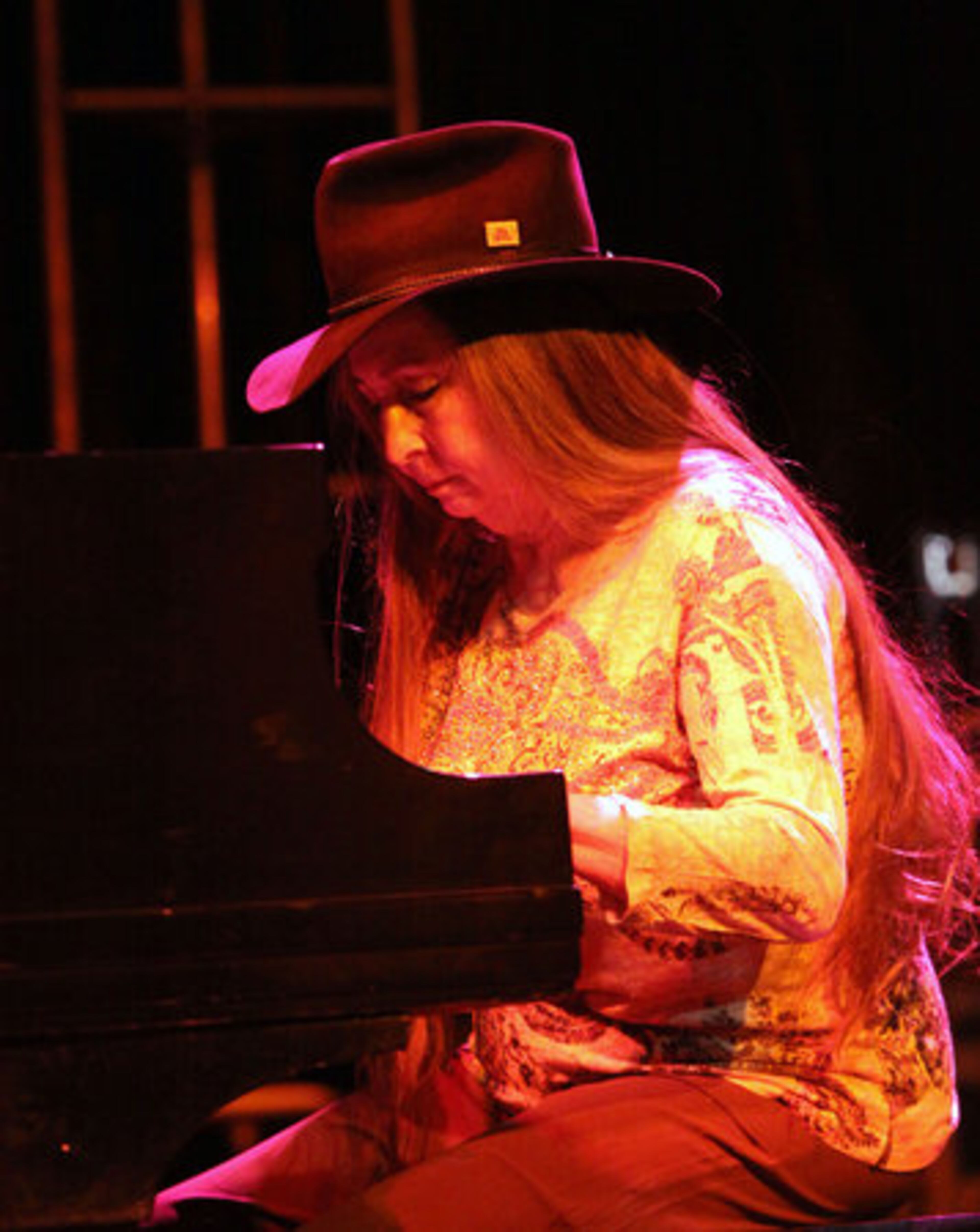 Bobbie Nelson plays the piano on "Shoe Shinin' Ma" for nearly 10,000 fans at the Willie Nelson Country Throwdown.