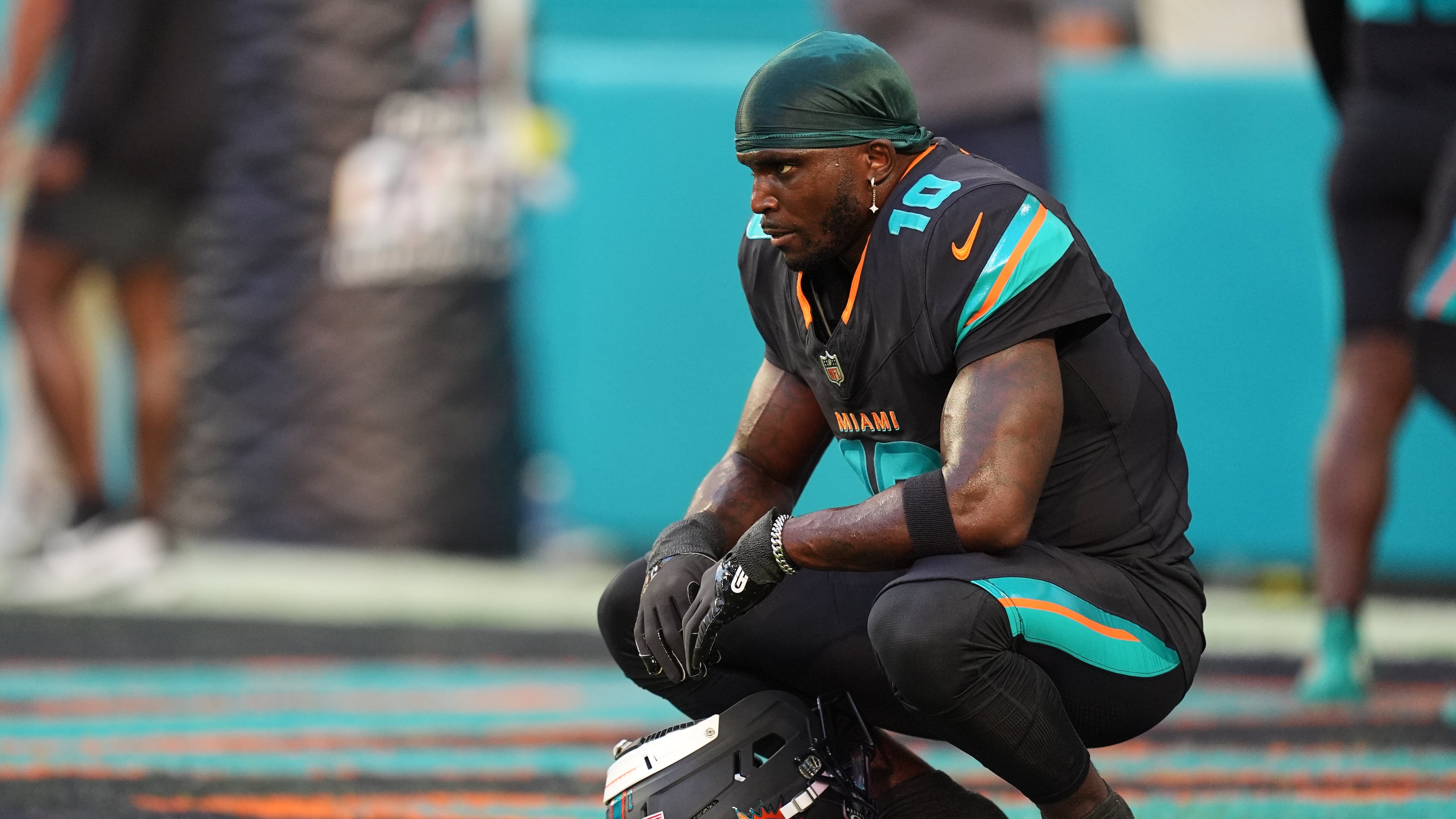 FILE - Miami Dolphins wide receiver Tyreek Hill sits in the end zone before an NFL football game against the New York Jets, Sept. 29, 2025, in Miami Gardens, Fla. (AP Photo/Rebecca Blackwell, File)