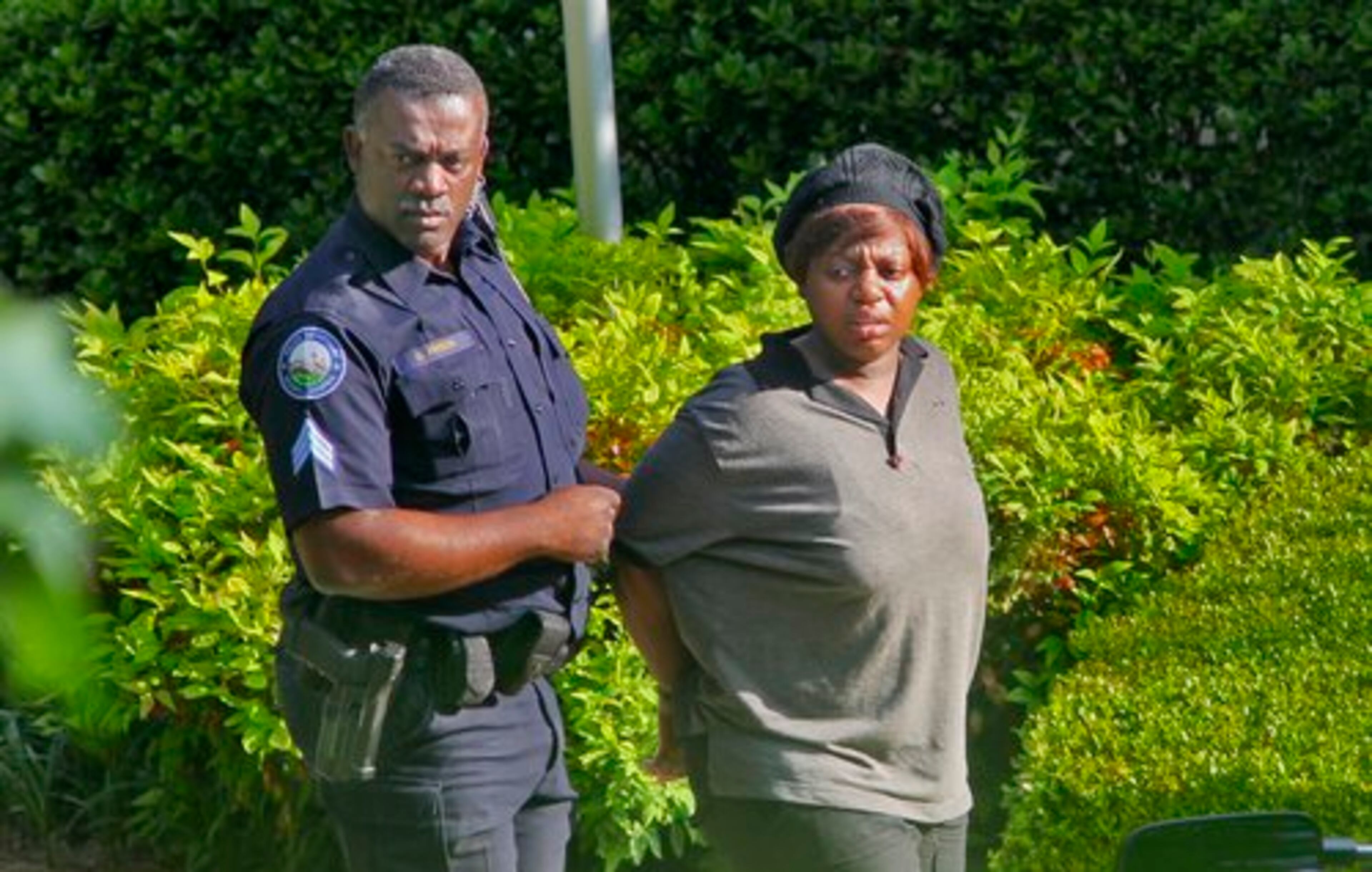 A woman was also taken into custody by police Tuesday.