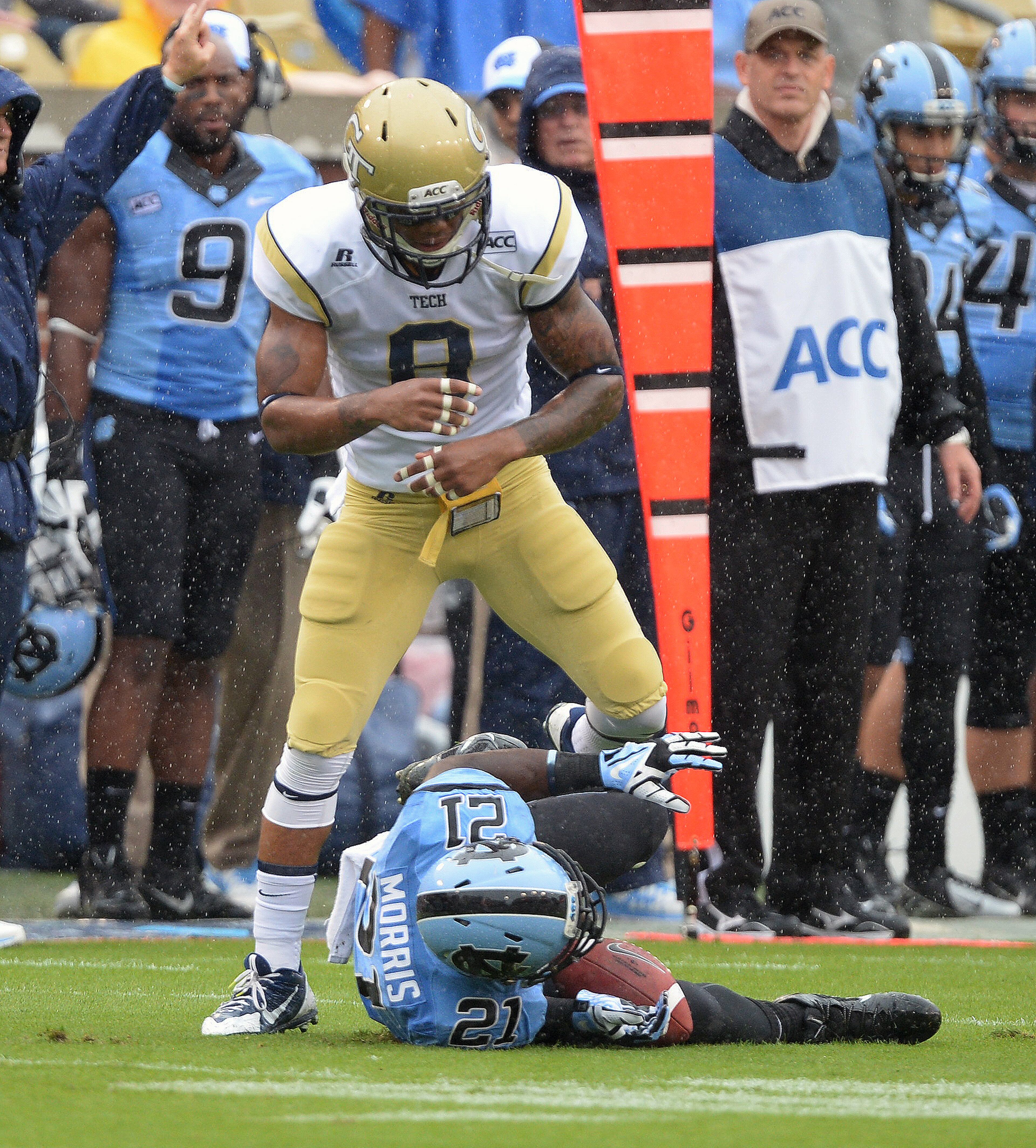 Georgia Tech's Louis Young stands over North Carolina's Romar Morris (21) inside Bobby Dodd Stadium on Saturday.