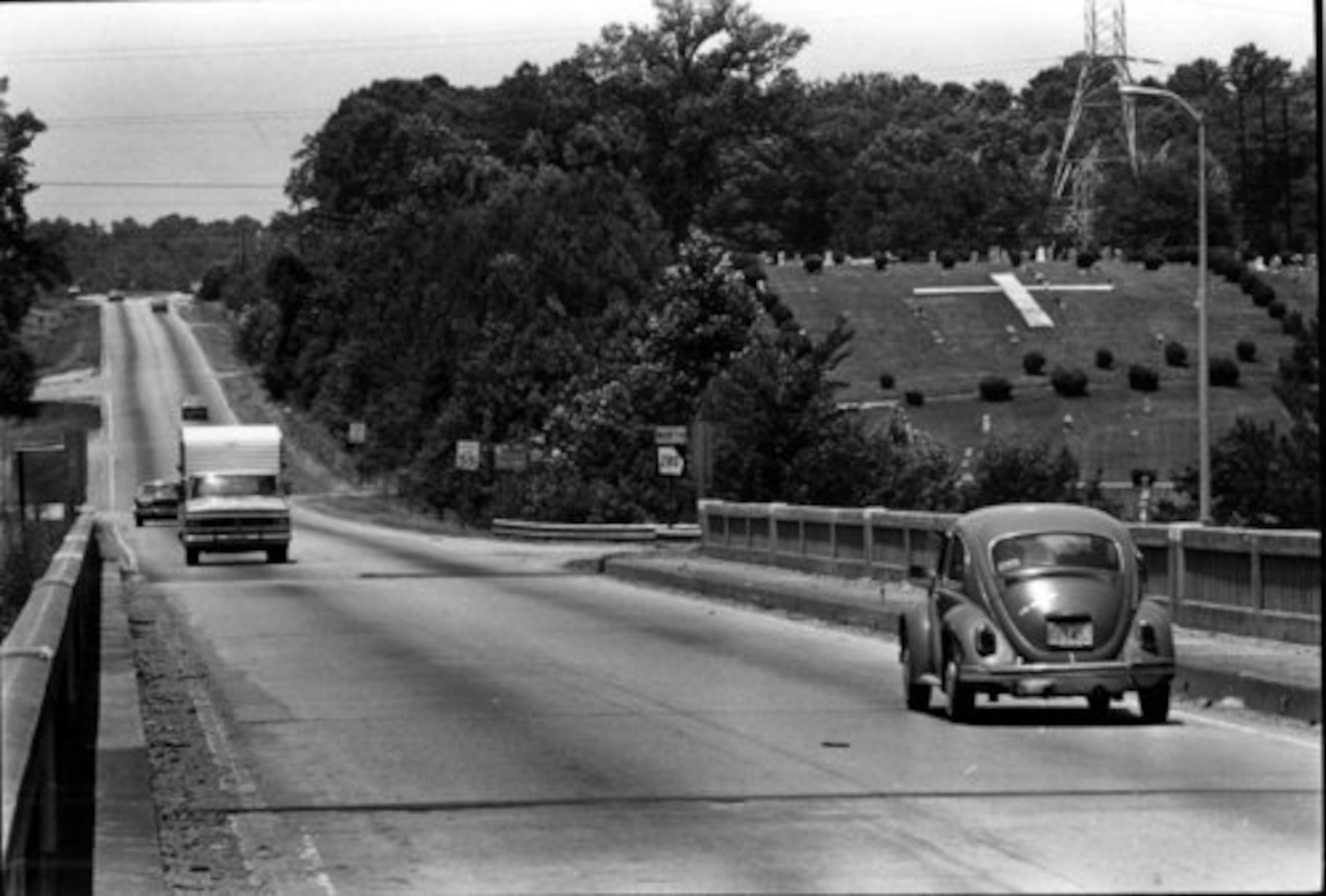 A Volkswagen heads north into what was then semi-rural Cobb County on the South Cobb Drive bridge over the Chattahoochee River. It was on this bridge that Wayne Williams was sighted the night of May 22, 1981 - the event that eventually led to his arrest in the murder of Nathaniel Cater.