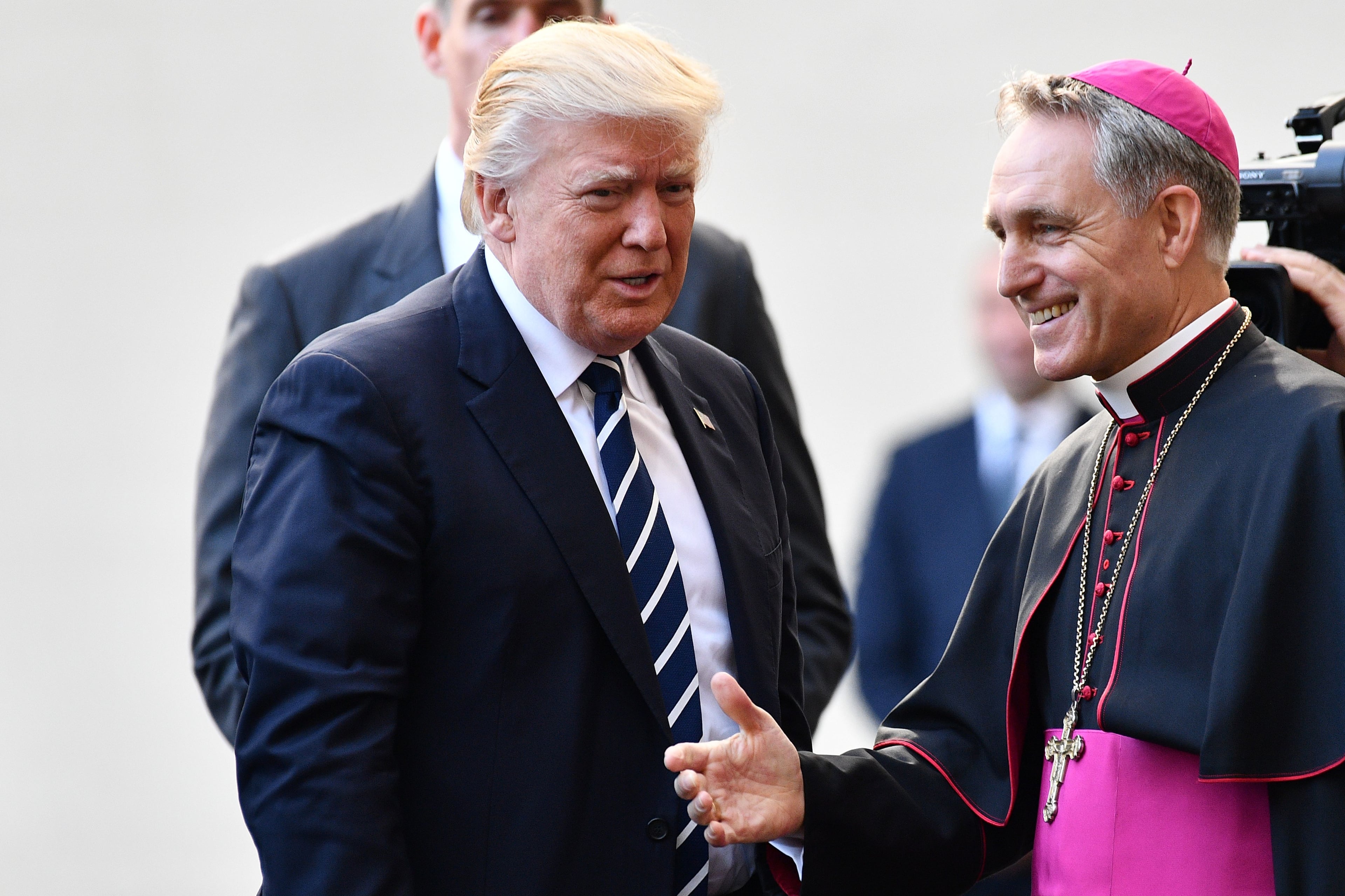 US President Donald Trump (L) is welcomed by the prefect of the papal household Georg Gaenswein as he arrives at the Vatican for a private audience with Pope Francis on May 24, 2017. / AFP PHOTO / Vincenzo PINTO (Photo credit should read VINCENZO PINTO/AFP/Getty Images)