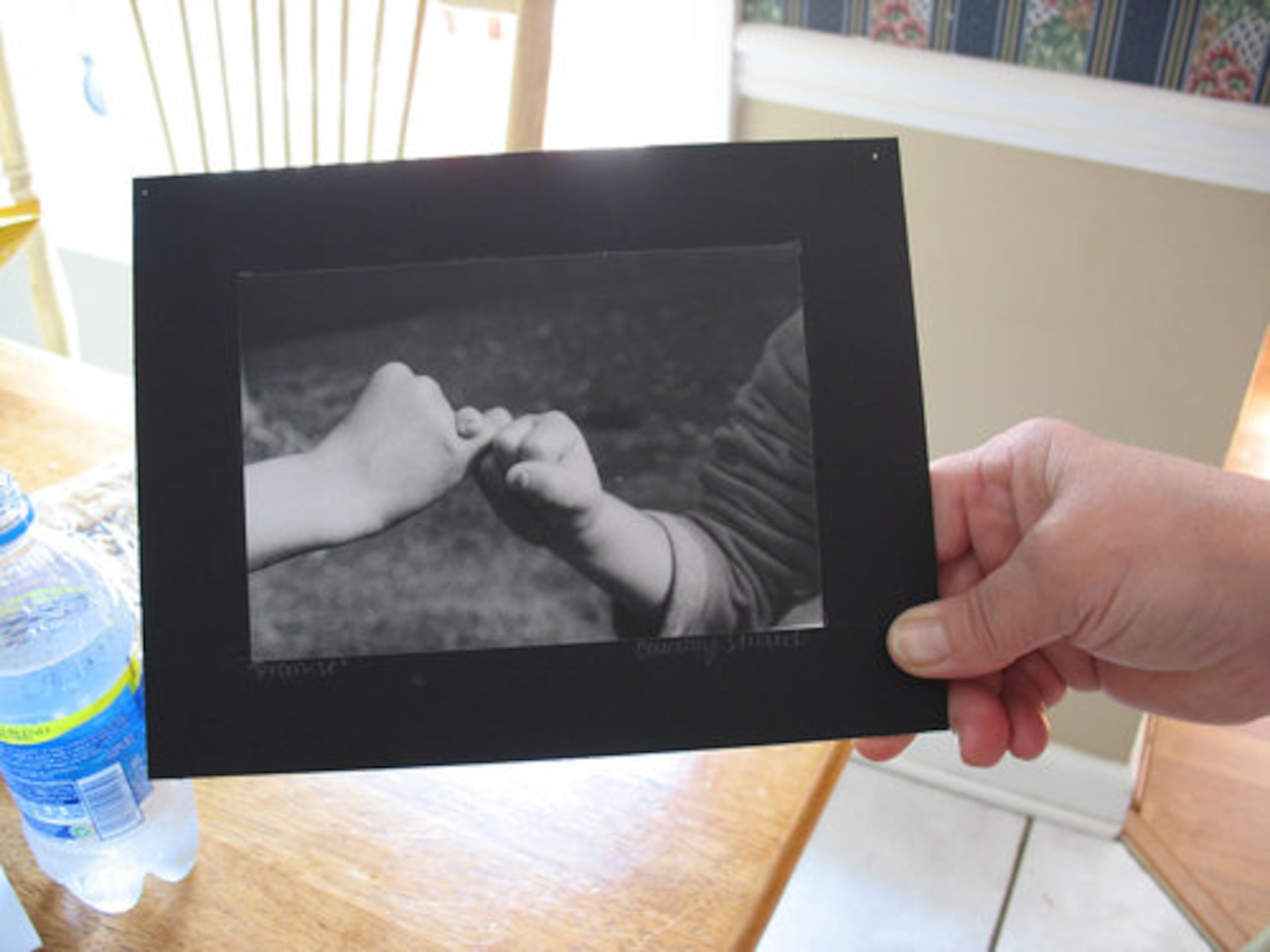 Jeanette Lang, Courtney Stroud's maternal grandmother, holds "Promise," a photograph the teenager made with her brother, Jordan Stroud, about two years ago.