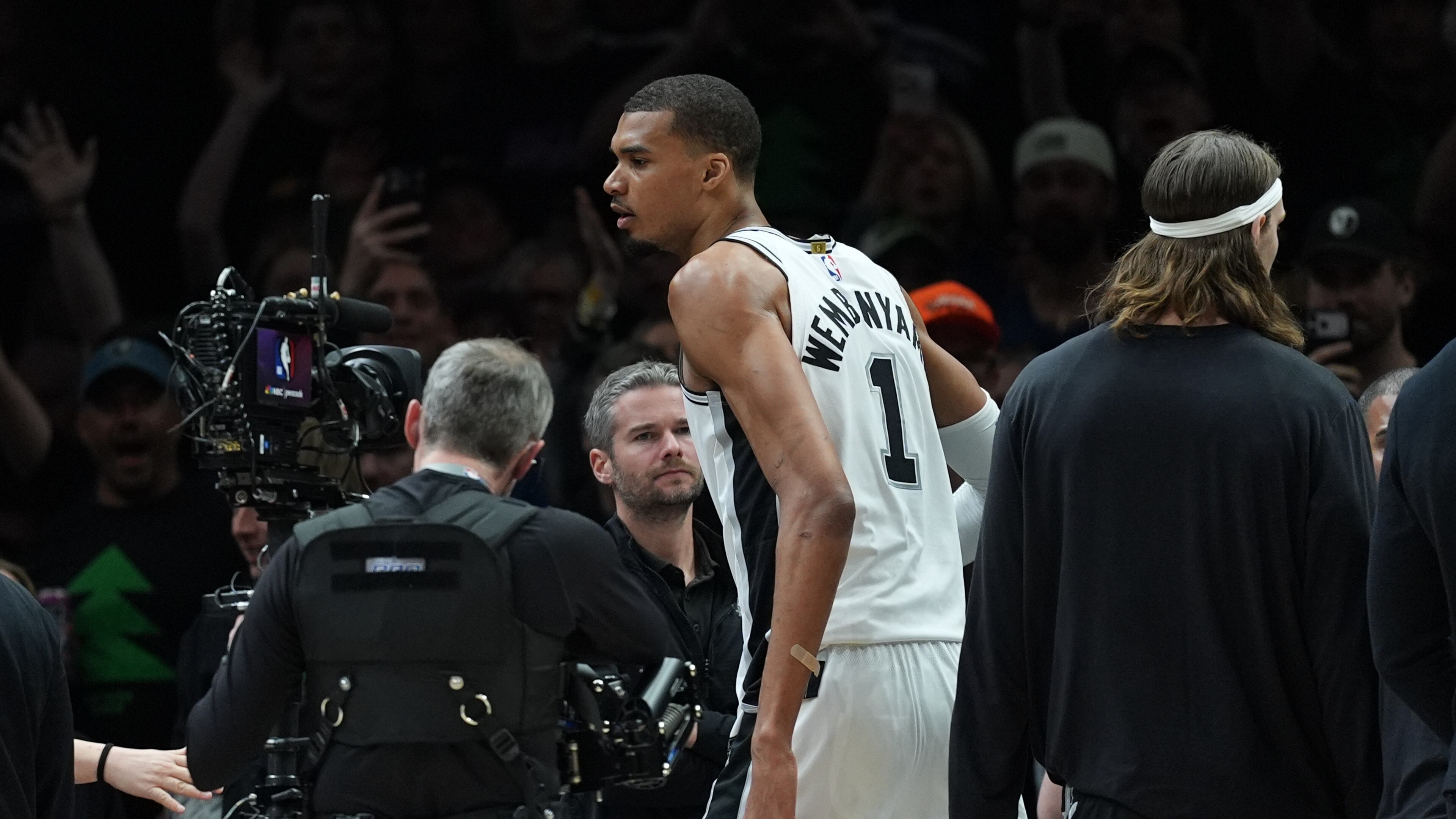 San Antonio Spurs forward Victor Wembanyama (1) reacts after he was ejected for a flagrant foul during the first half of Game 4 of a NBA basketball second-round playoff series against the Minnesota Timberwolves in Minneapolis, Sunday, May 10, 2026. (AP Photo/Abbie Parr)