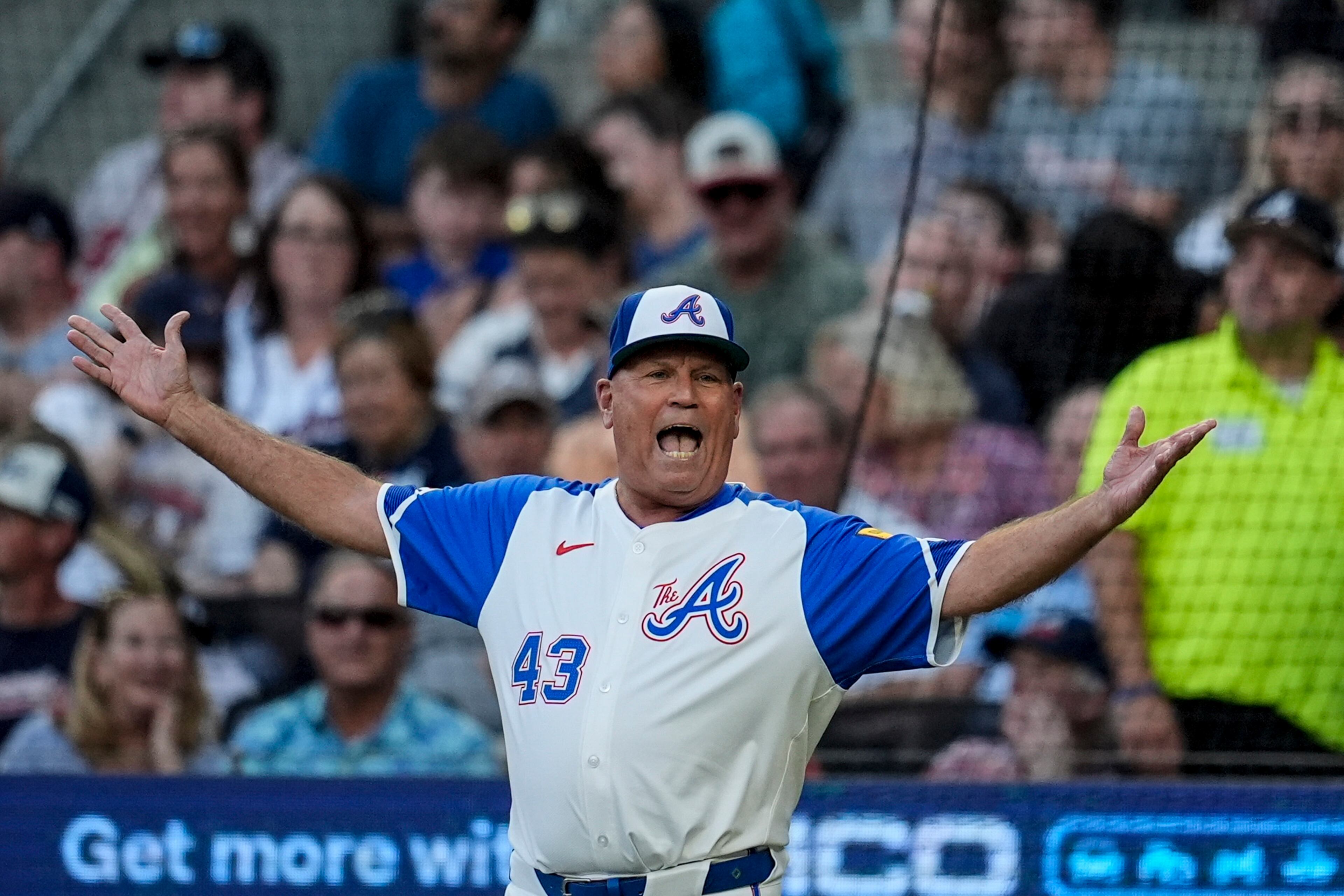 Atlanta Braves manager Brian Snitker (43) argues in the second inning of a baseball game against the Washington Nationals, Saturday, Aug. 24, 2024, in Atlanta. The Braves won 4-2. (AP Photo/Mike Stewart)