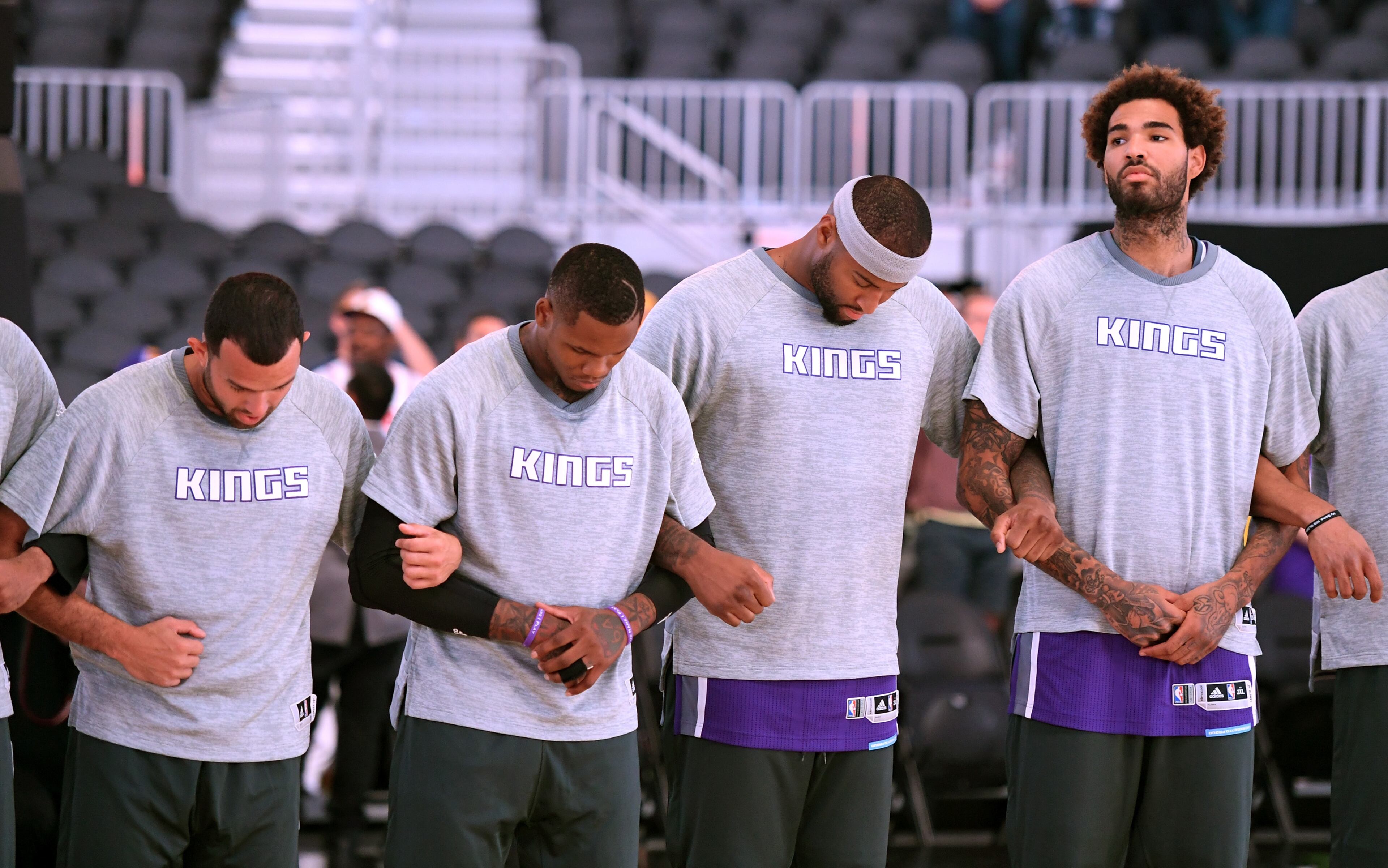 (Left to right) Jordan Farmar, DeMarcus Cousins, Ben McLemore and Willie Cauley-Steinof the Sacramento Kings lock arms as the American national anthem is performed before their preseason game against the Los Angeles Lakers at T-Mobile Arena on October 13, 2016 in Las Vegas, Nevada. Sacramento won 116-104. (Photo by Ethan Miller/Getty Images)