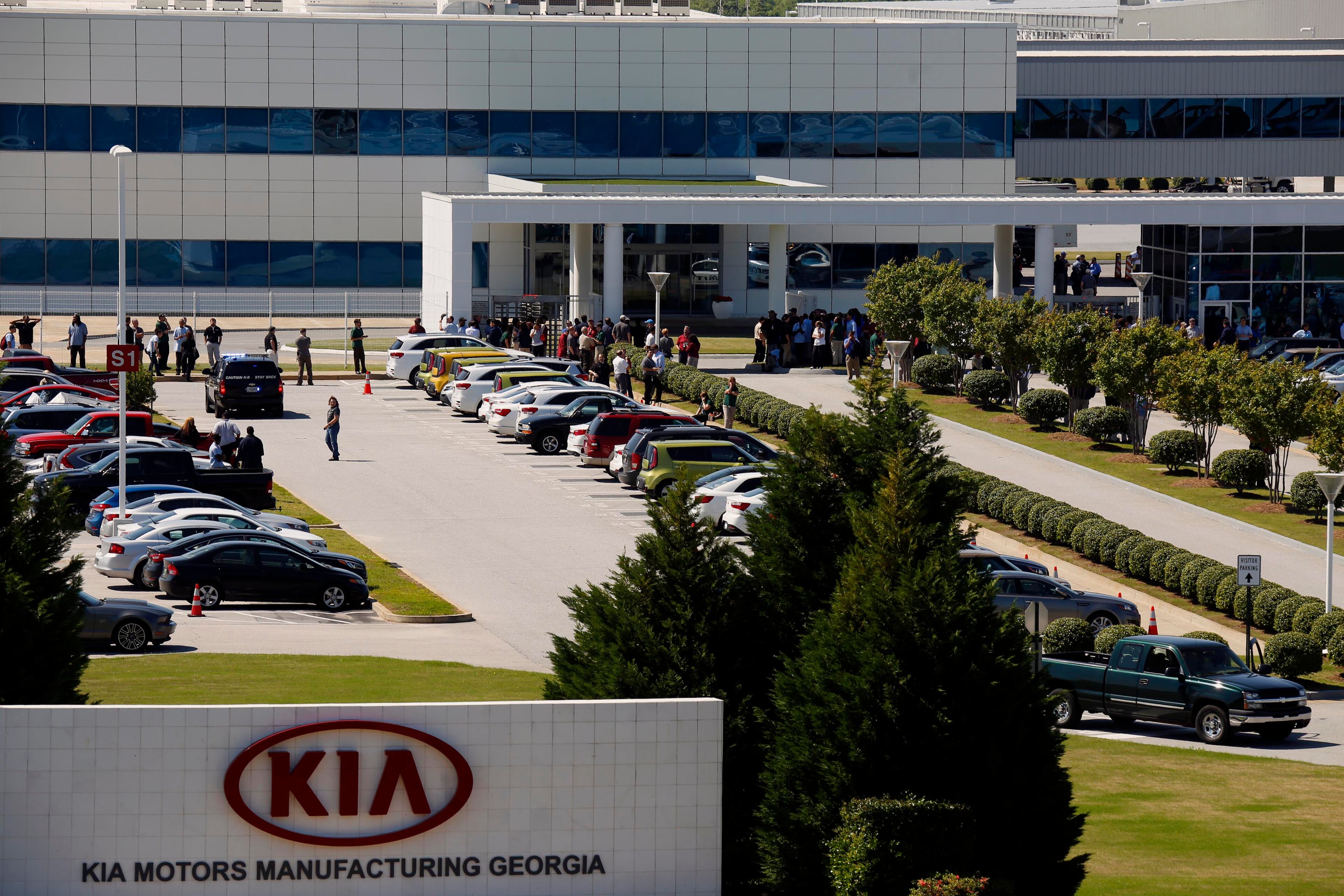 Authorities investigate after a shooting at a Kia Motors automobile plant Tuesday, April 21, 2015, in West Point, Ga. Troup County sheriff's Sgt. Stewart Smith, who confirmed the shooting Tuesday, said one person was wounded and had been taken to a hospital by helicopter. He said authorities had a lone suspect in custody. (Todd J. Van Emst/Opelika-Auburn News via AP)