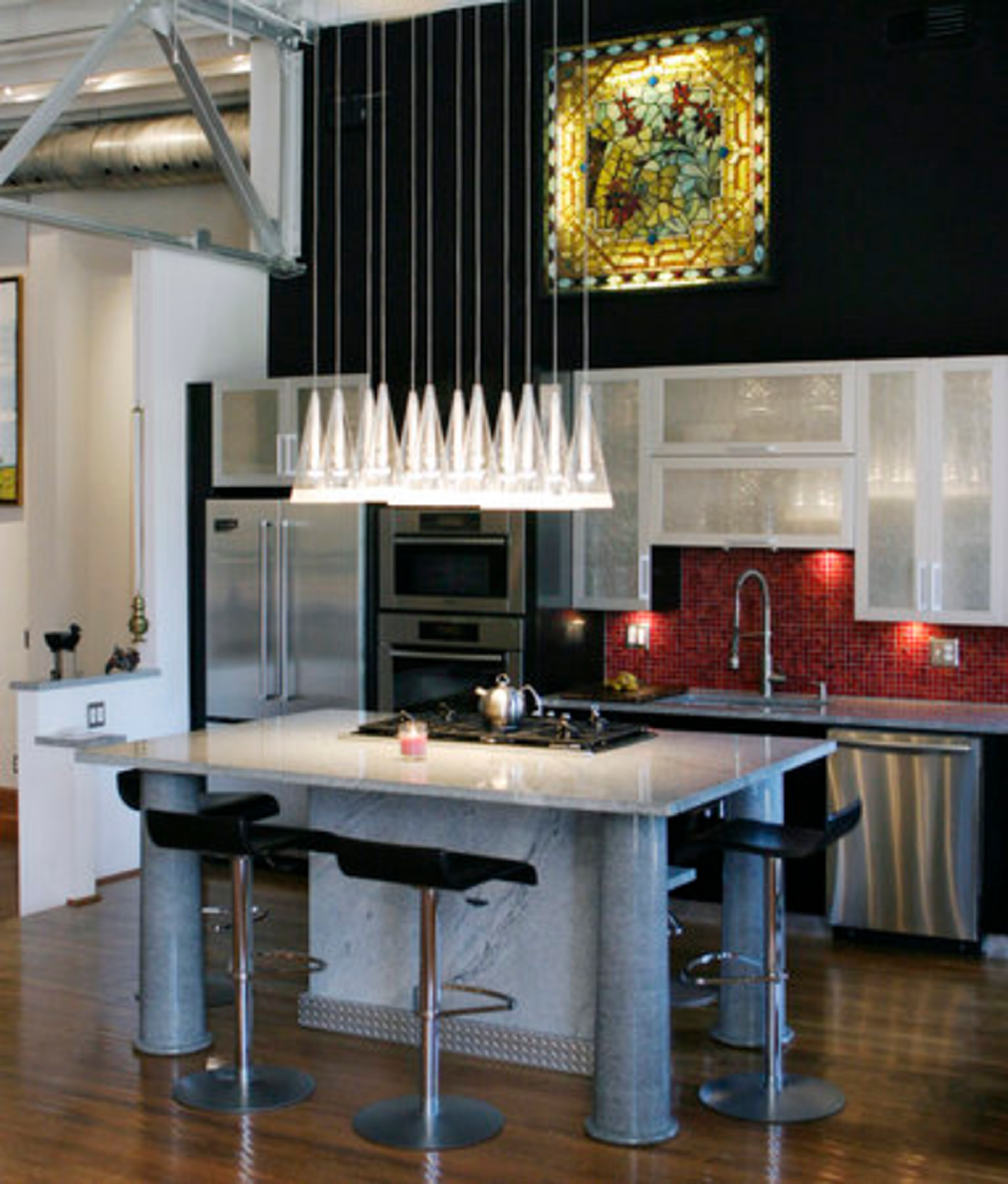 The kitchen has a mostly contemporary feel. Besharat says it is the heart of his home.