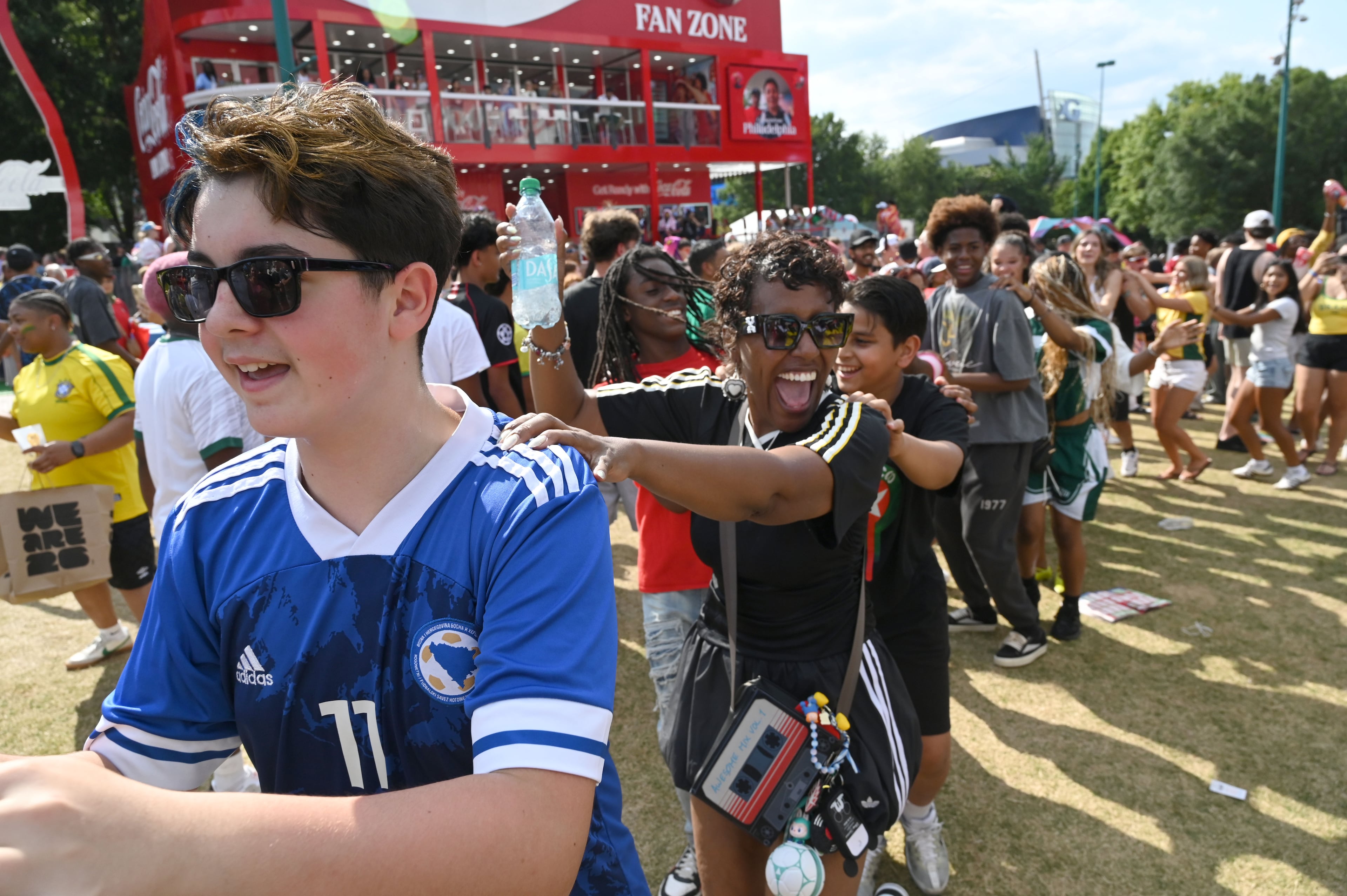 Soccer fans cheer and dance at the FIFA Fan Festival in Centennial Olympic Park on Wednesday, June 24, 2026, in Atlanta. (Hyosub Shin/AJC)