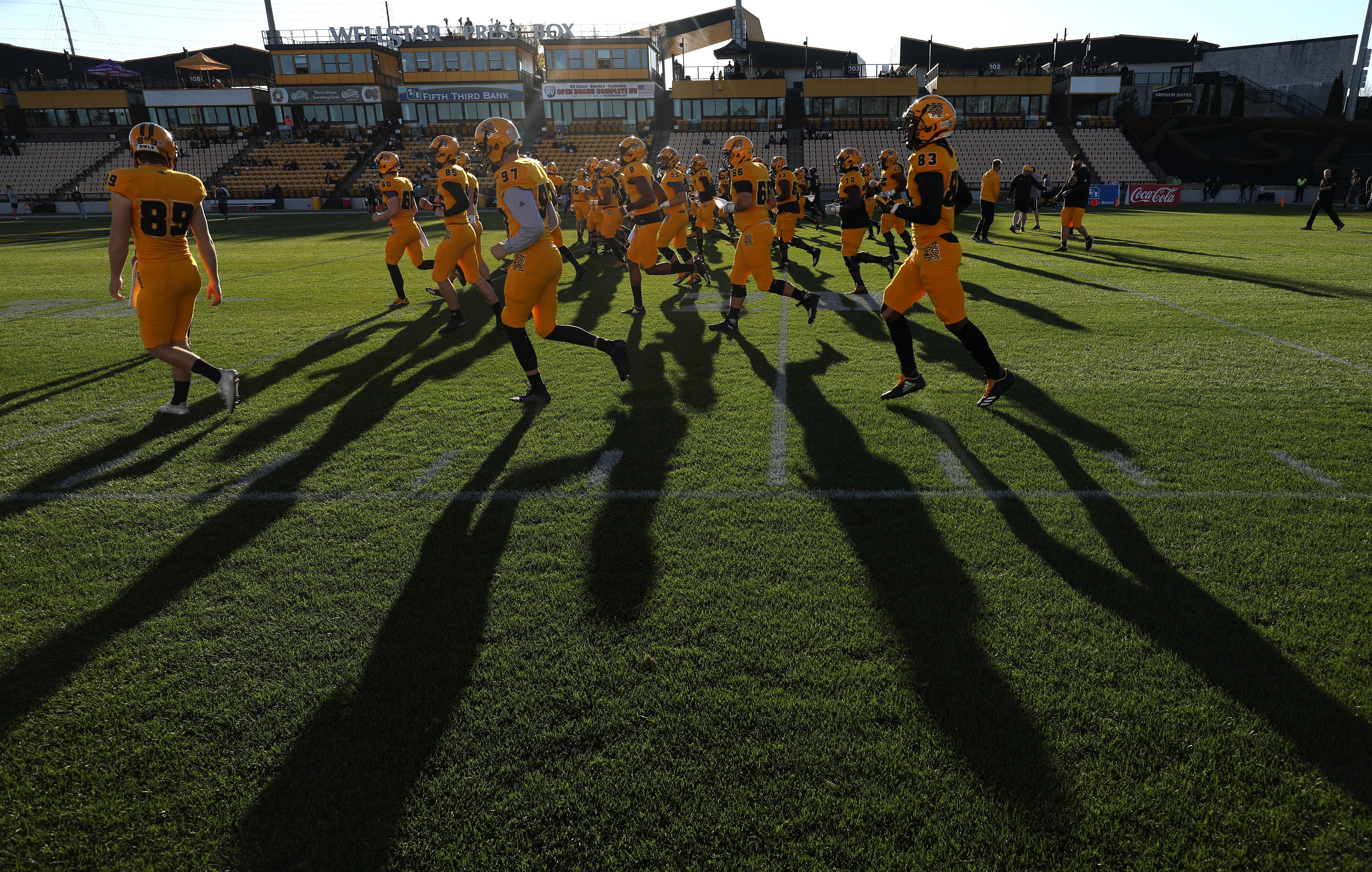 March 22, 2019 - Kennesaw, Ga: Kennesaw State Owls football players warm-up before their spring football game at Fifth Third Bank Stadium Friday, March 22, 2019 in Kennesaw, Ga.. (JASON GETZ/SPECIAL TO THE AJC)