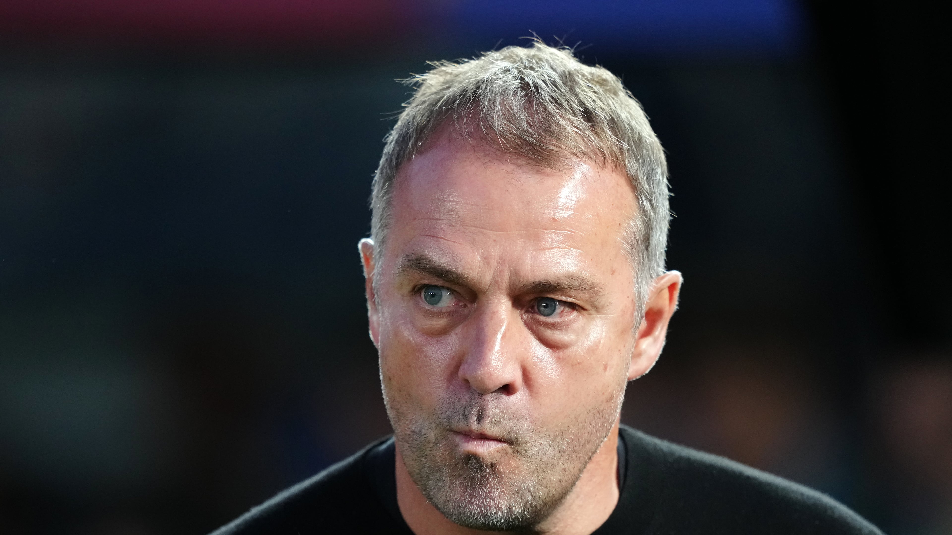 Barcelona head coach Hansi Flick stands by the touchline before the Spanish La Liga soccer match between FC Barcelona and Real Madrid in Barcelona, Spain, Sunday, May 10, 2026. (AP Photo/Joan Mateu Parra)