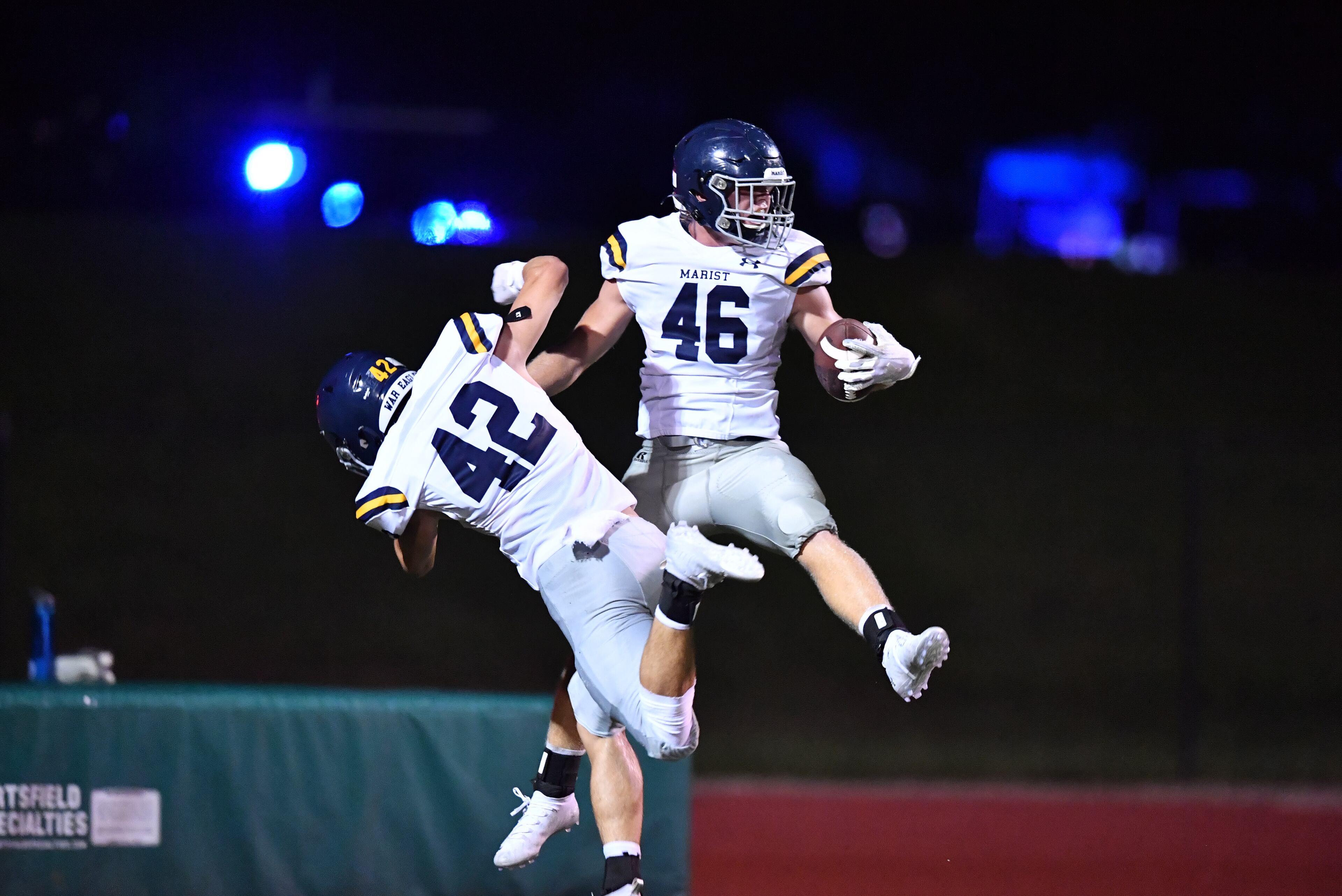 August 27, 2021 Roswell - Marist's Andrew Mannelly (46) celebrates with Marist's Billy Roche (42) after he scored a touchdown in the second half at Blessed Trinity Catholic High School in Roswell on Friday, August 27, 2021. Marist won 28-13 over Blessed Trinity. (Hyosub Shin / Hyosub.Shin@ajc.com)
