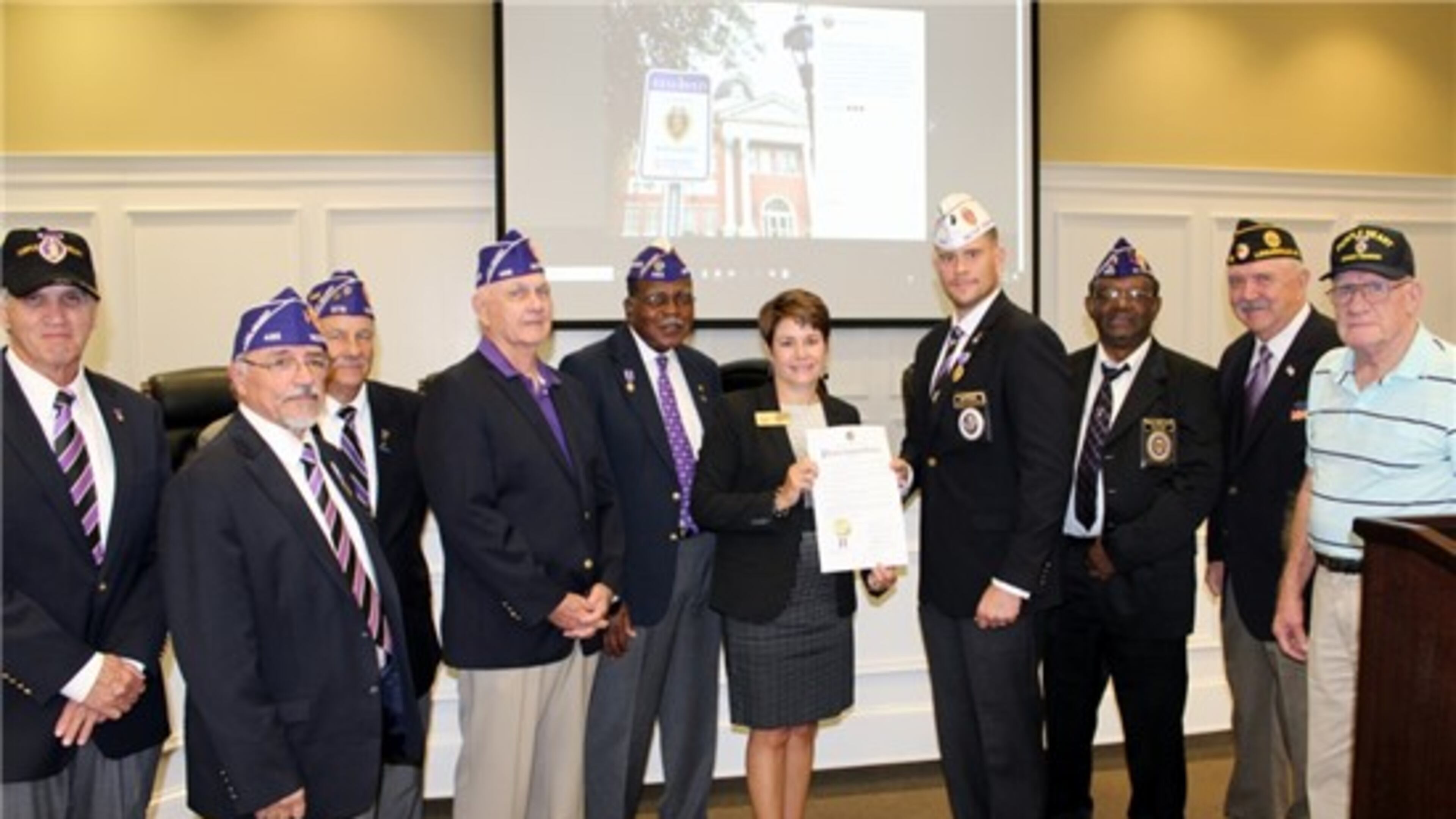 Snellville Mayor Pro Tem Barbara Bender presents the proclamation to Purple Heart Medal recipients. Courtesy City of Snellville