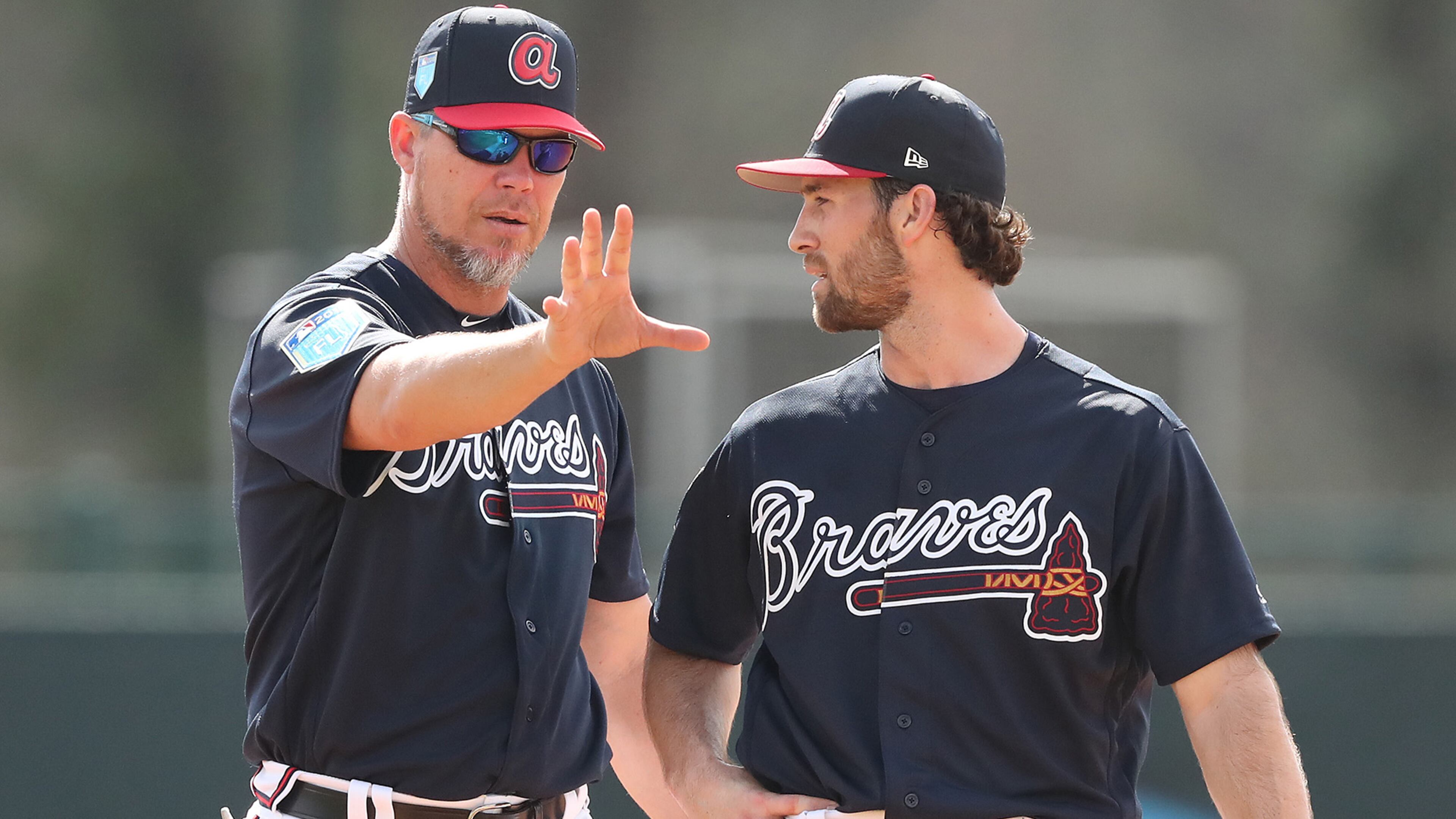 Braves recently elected Hall of Fame third baseman Chipper Jones works with infielder Charlie Culberson at spring training during the first full squad workout on Monday, Feb 19, 2018, at the ESPN Wide World of Sports Complex in Lake Buena Vista. Jones was helping coach the team for the day. Curtis Compton/ccompton@ajc.com