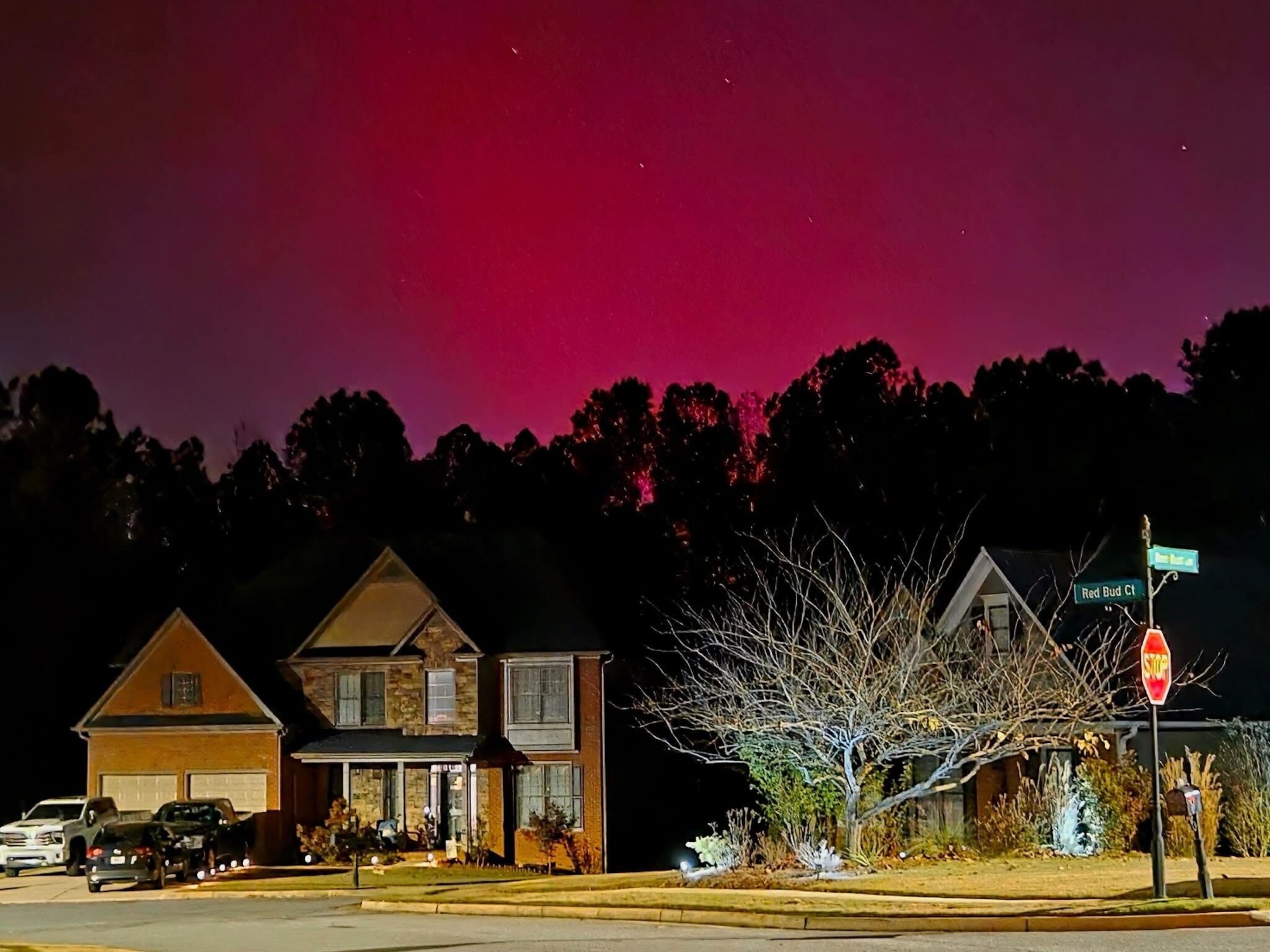 A glowing sky from the northern lights is shines above a Paulding County neighborhood near Dallas on Tuesday, Nov. 11, 2025. North Georgia could get another chance to see the display Wednesday night. (Photo courtesy of Heather Perry Brozowski)