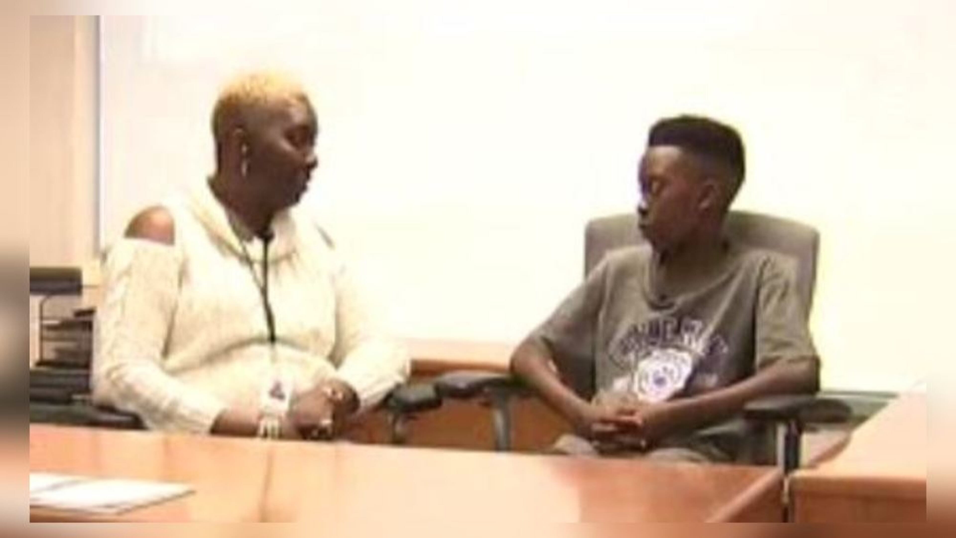 Angela Nichols (left) and her son Lyndon are upset about a school assignment in Gwinnett County.