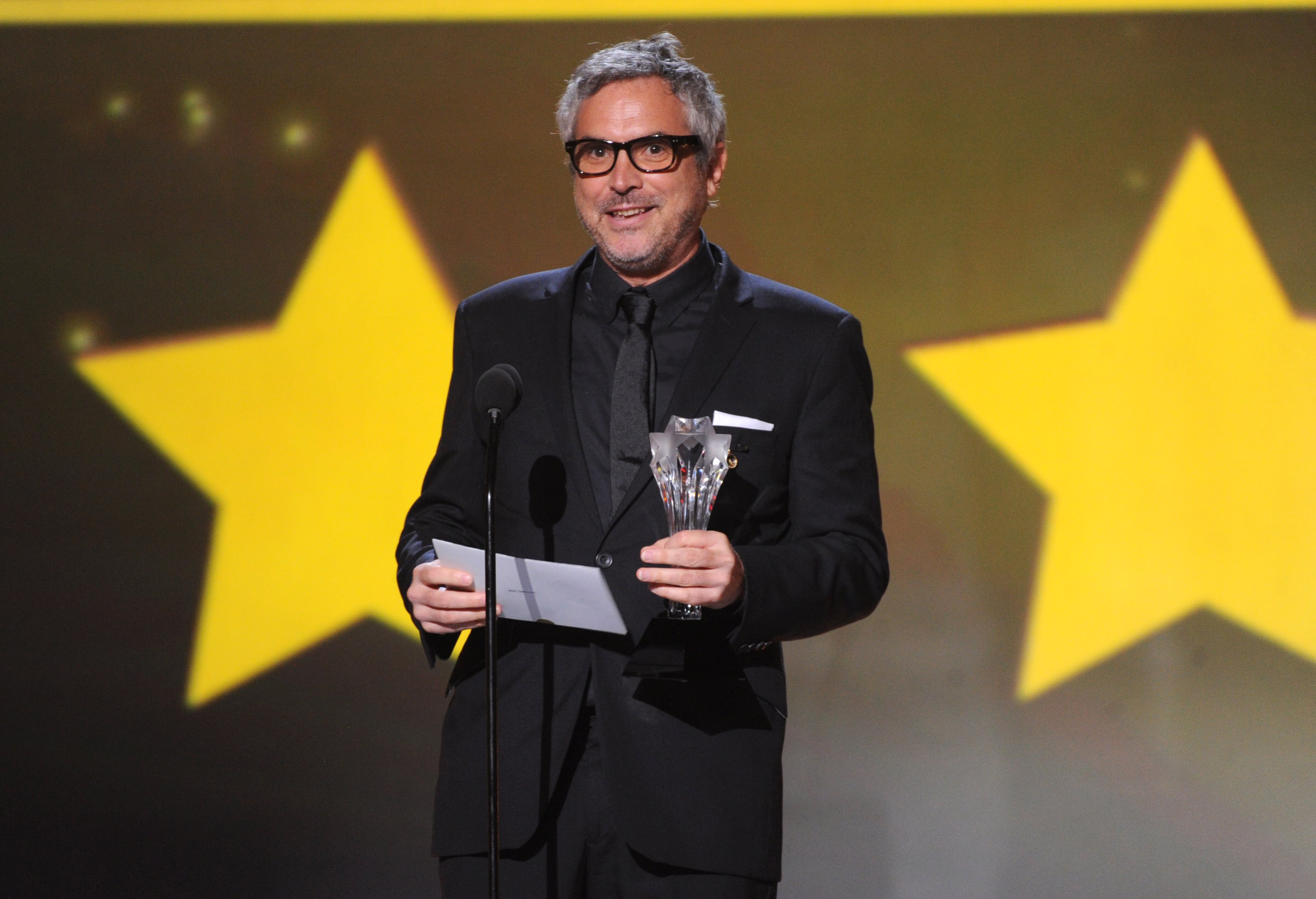 Alfonso Cuaron accepts the award for best director for "Gravity" at the 19th annual Critics' Choice Movie Awards at the Barker Hangar on Thursday, Jan. 16, 2014, in Santa Monica, Calif. (Photo by Frank Micelotta/Invision/AP)