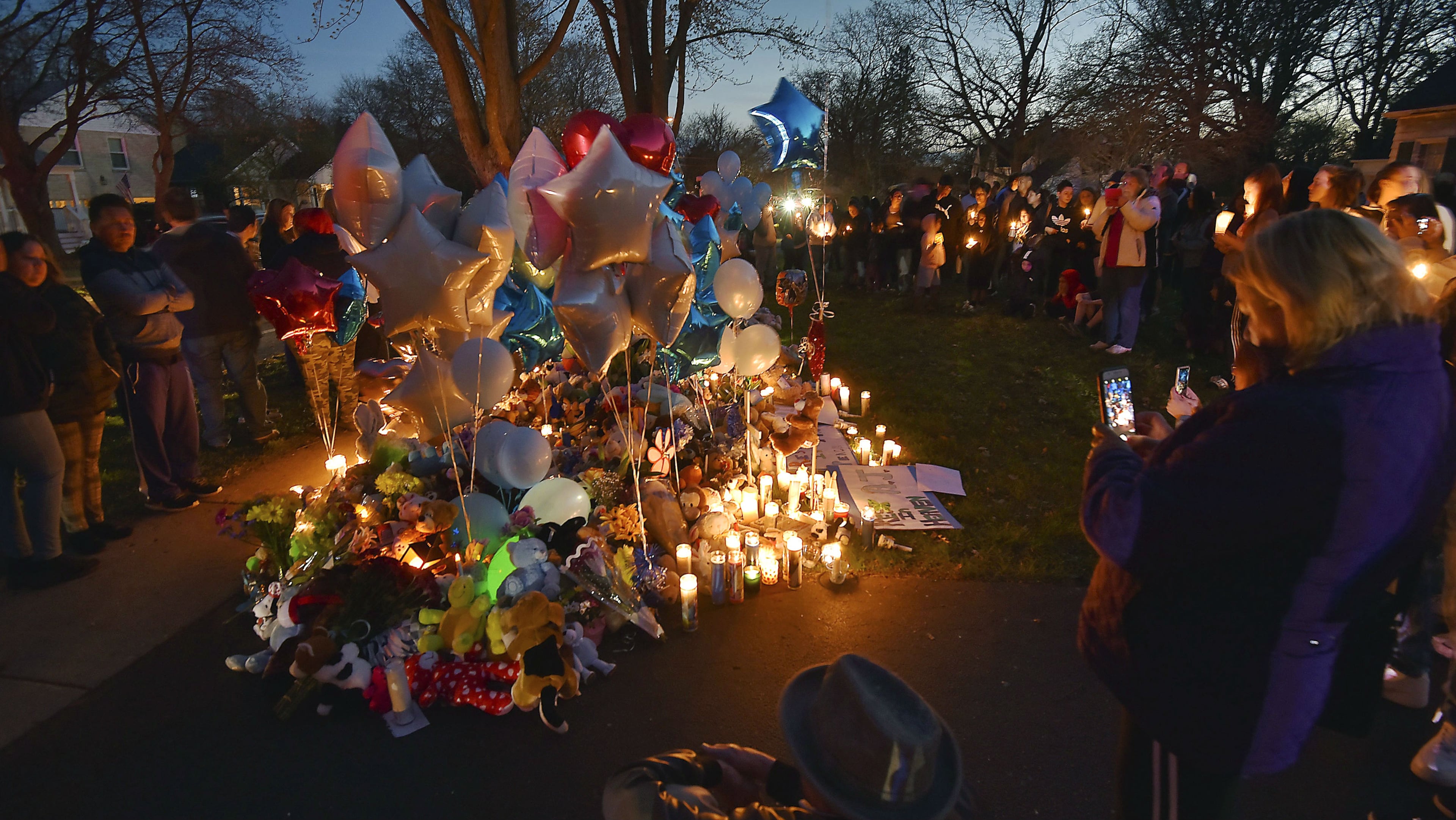 Residents of Crystal Lake, Ill., hold a candlelight vigil April 24, 2019 for Andrew "AJ" Freund Jr., 5, whose body was found buried in a shallow grave earlier that day. AJ’S parents, Andrew Freund Sr., 60, and JoAnn Cunningham, 36, face multiple charges, including five counts of first-degree murder, in his April 15 death. The boy was reported missing from the family's home April 18, 2019.