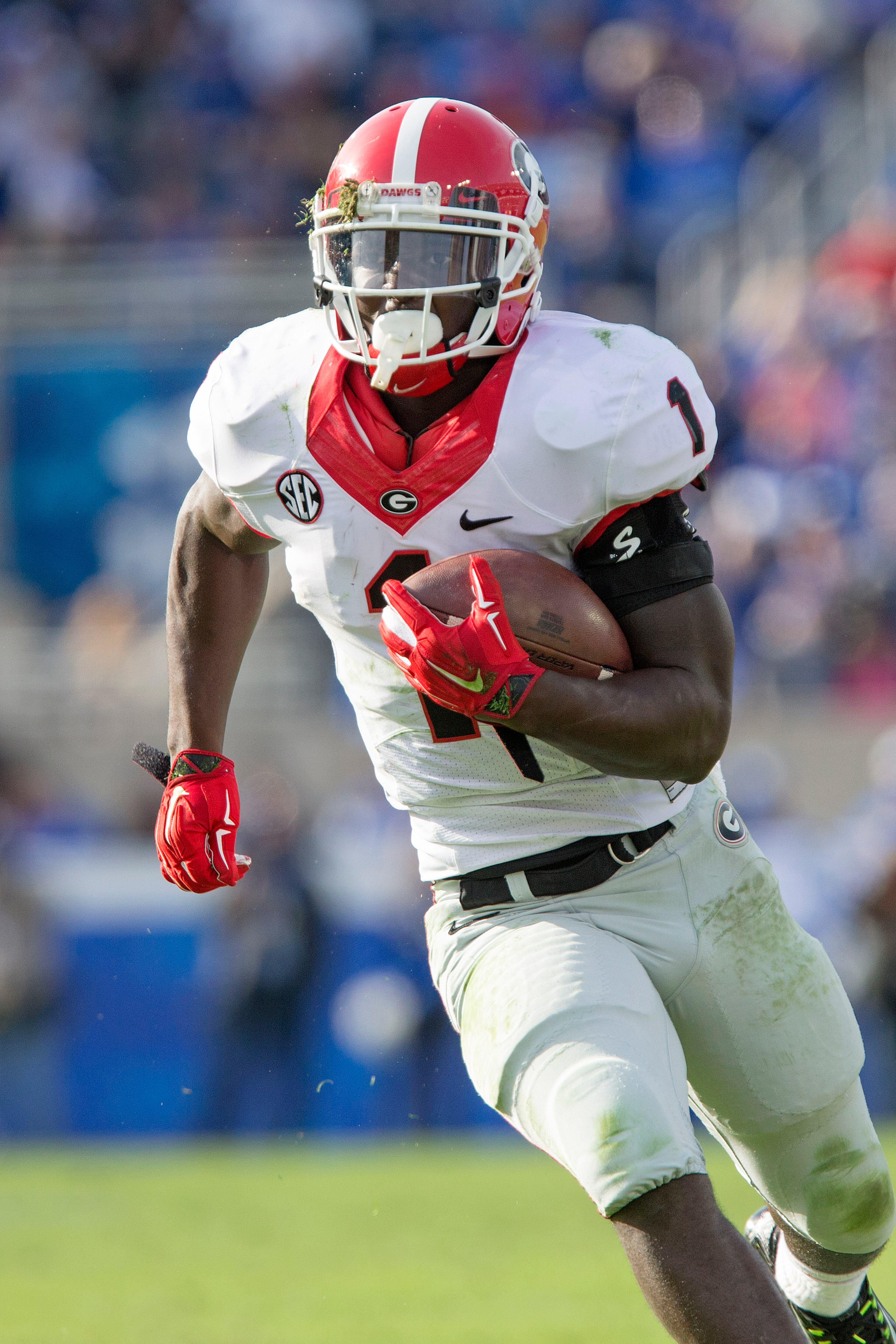 Georgia running back Sony Michel makes a 23-yard touchdown run during the second half of an NCAA college football game against Kentucky at Commonwealth Stadium in Lexington, Ky., Saturday, Nov. 8, 2014. Georgia beat Kentucky 63-31. (AP Photo/David Stephenson)