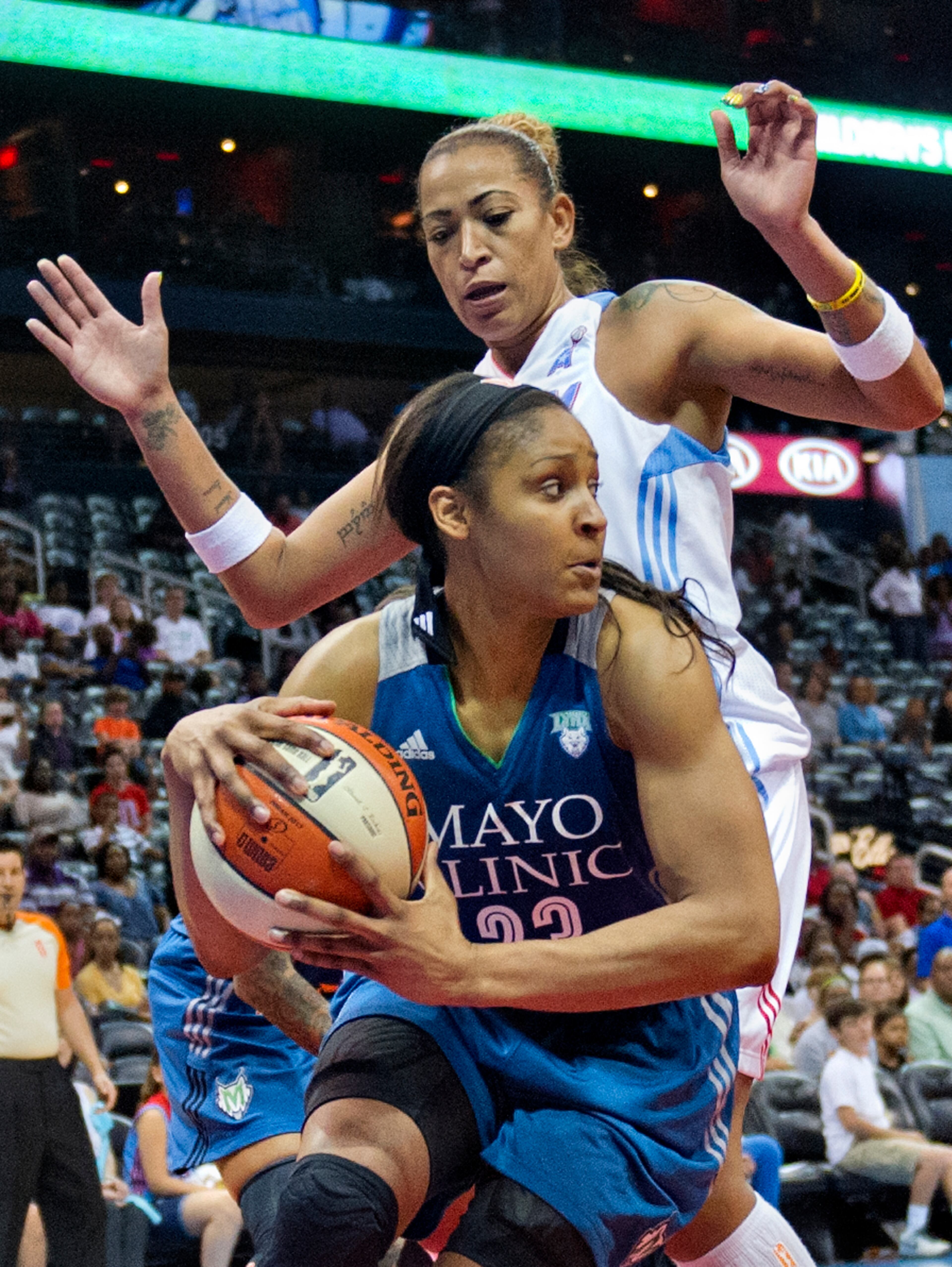 Minnesota's Maya Moore (23) is guarded by Atlanta's Erika de Souza during their game at Philips Arena in Atlanta on Friday, June 13, 2014. The Dream defeated the Lynx 85-82.