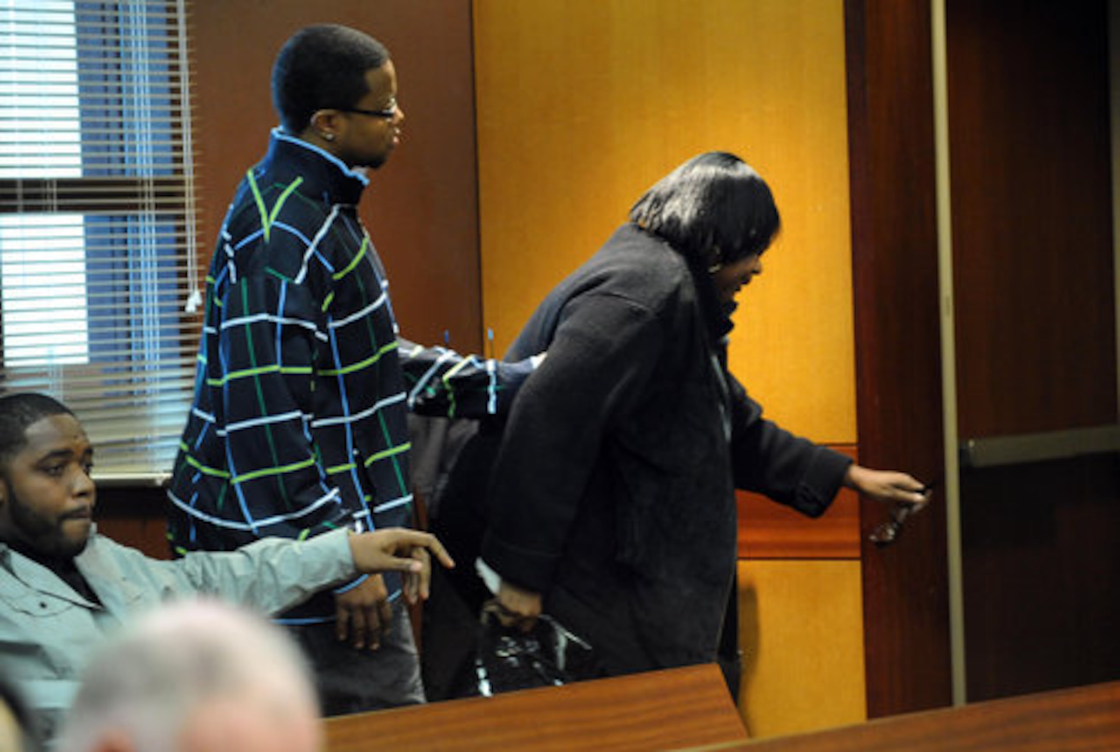 Benton's aunt, Sheila Kitchens, leaves the courtroom.
