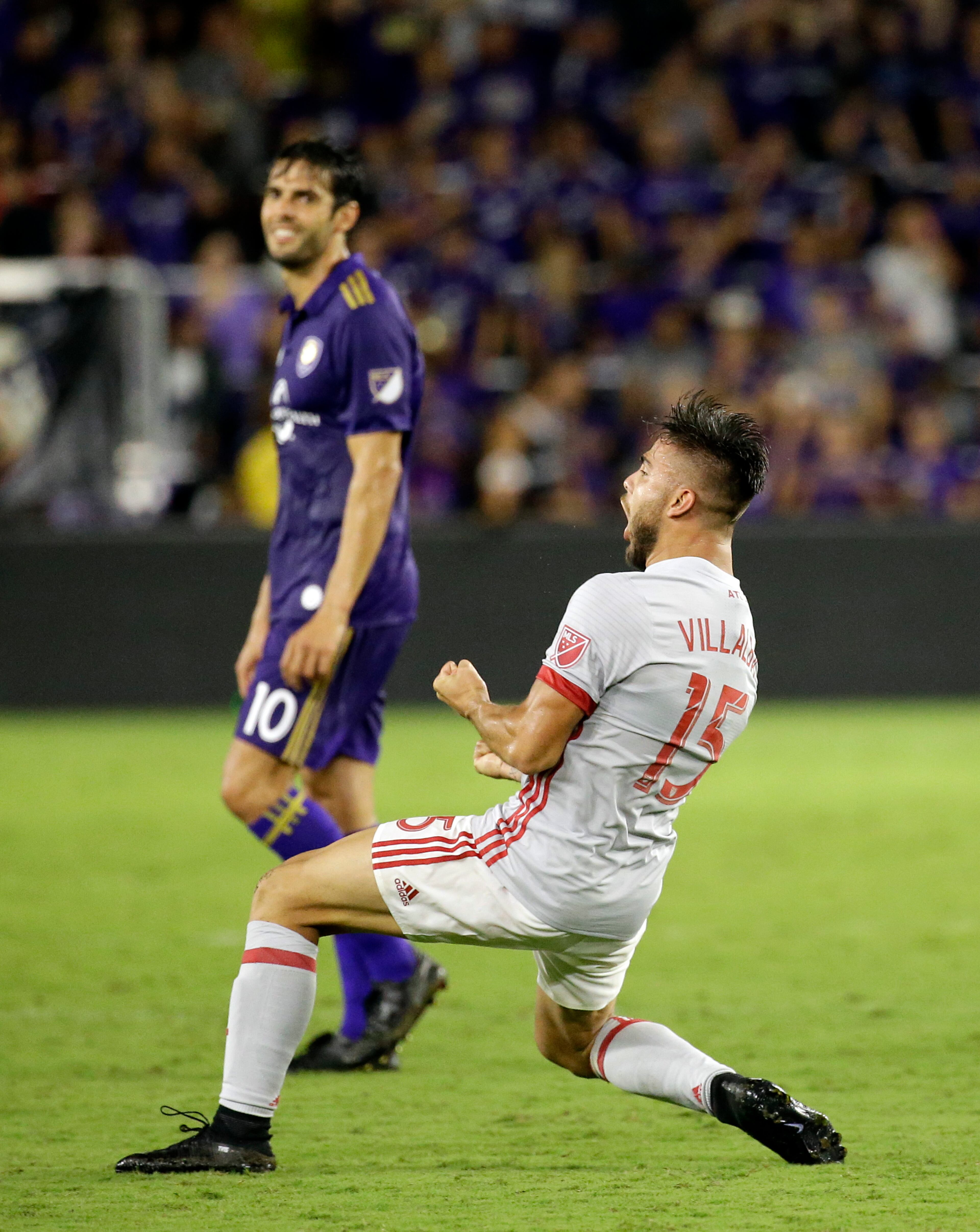 Atlanta United's Hector Villalba, right, celebrates in front of Orlando City's Kaka after scoring a goal in the second half of an MLS soccer match, Friday, July 21, 2017, in Orlando, Fla. Atlanta United won 1-0. (AP Photo/John Raoux)