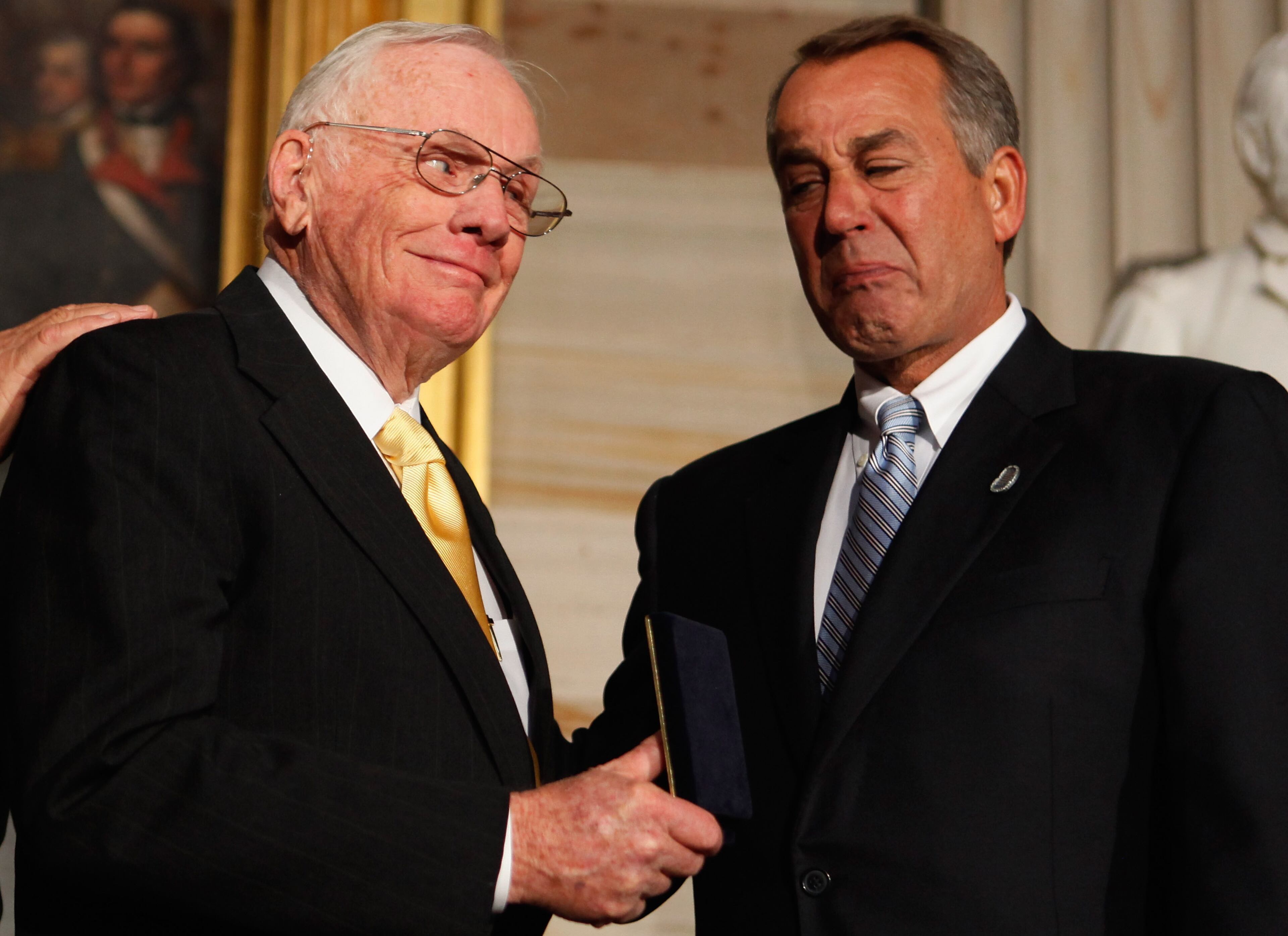Speaker of the House John Boehner (R-OH) holds back tears as he presents Astronaut Neil Armstrong (L) with the Congressional Gold Medal during a ceremony in the Rotunda of the U.S. Capitol November 16, 2011 in Washington, DC. The gold medals were presented to Armstrong and his fellow crew members from Apollo 11, Michael Collins and Buzz Aldrin, and to astronaut and former U.S. Senator John Glenn (D-OH), the first American to orbit the Earth.