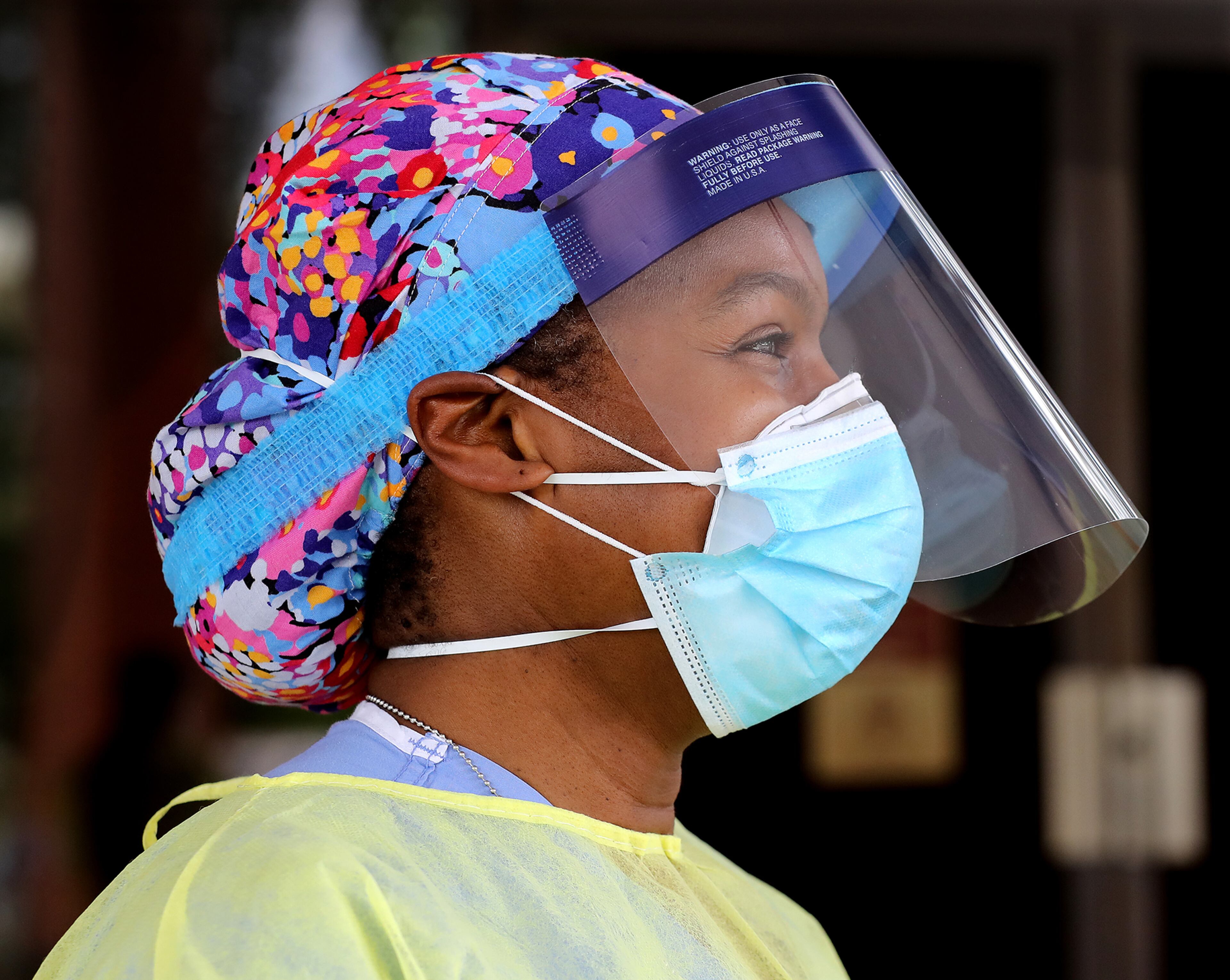 Wendy Greene, an Emory Hospital MD, volunteers her time to help take free COVID-19 testing at a pop-up site at the House of Hope on Monday, May 4, in Decatur. Pastors, local physicians, health ministers, and other community leaders united to encourage area residents to get tested.