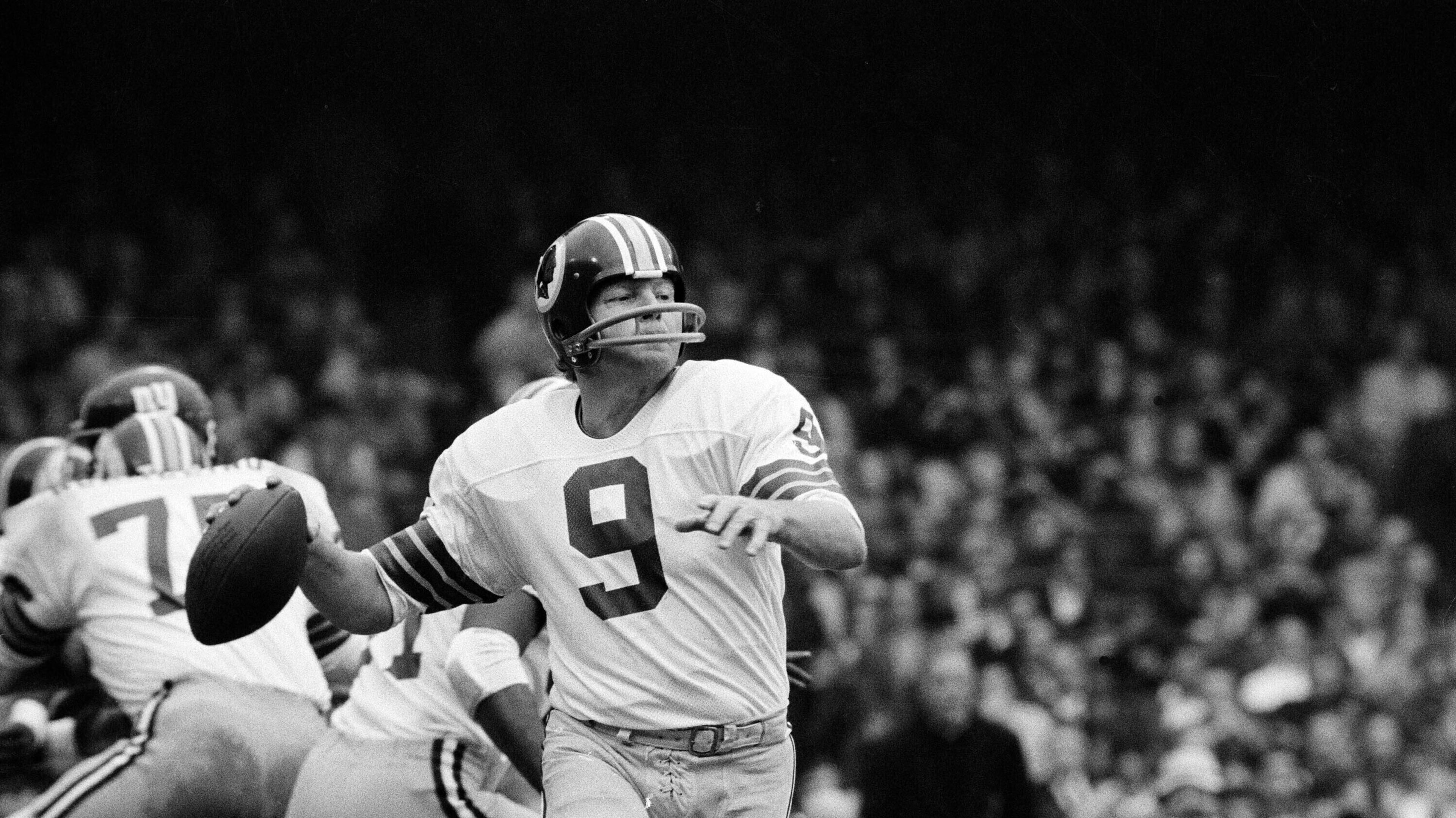 FILE - Washington quarterback Sonny Jurgensen looks to pass against the New York Giants during an NFL football game in 1974. (AP Photo/File)