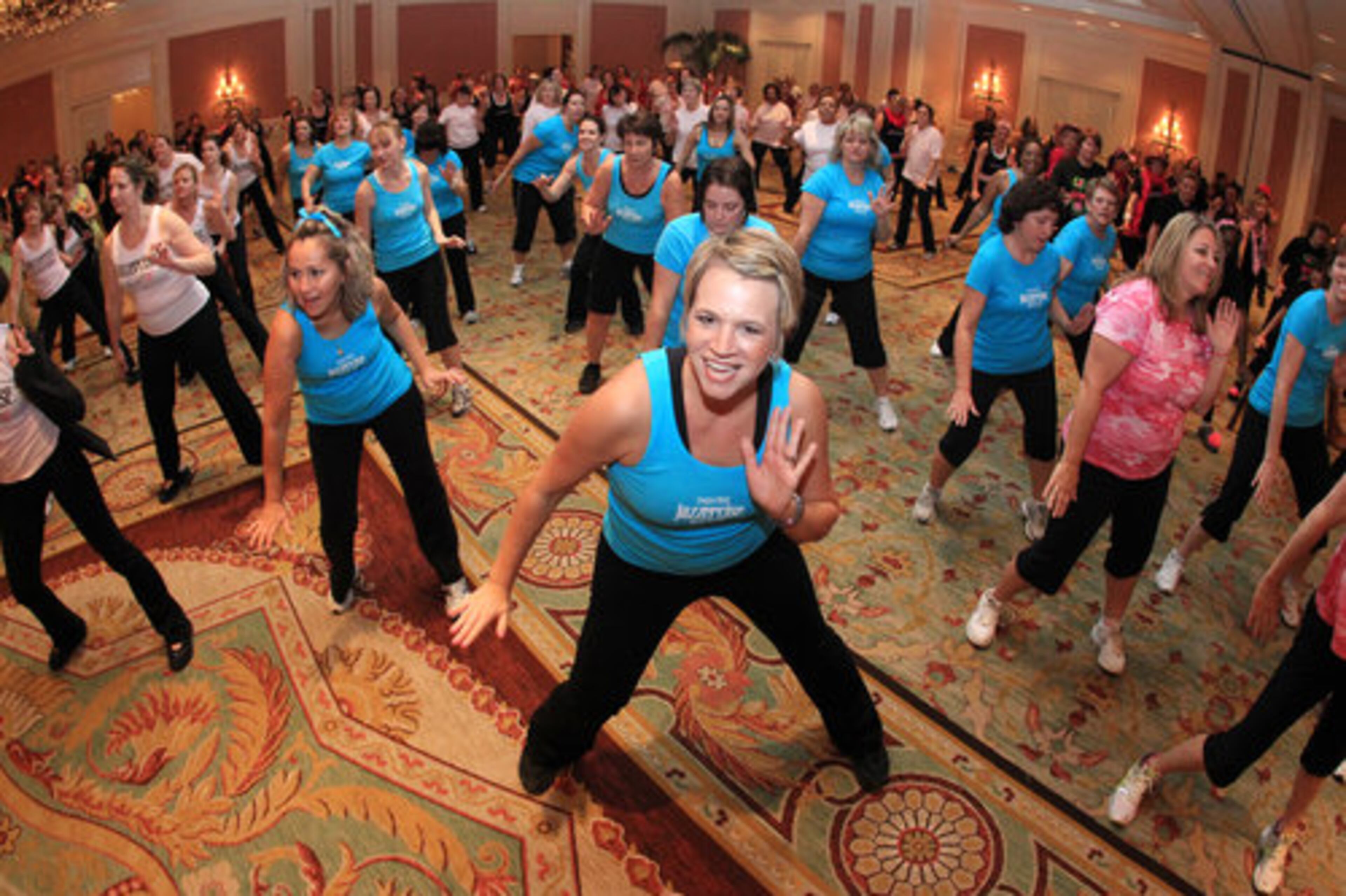 Amie Bryans, owner of Sugar Hill Jazzercise, leads her team during the 9th annual Jazzerthon for the Cure during three hours of continuous, high-energy group fitness classes featuring around 500 Jazzercisers from across Georgia in Buckhead Sunday.