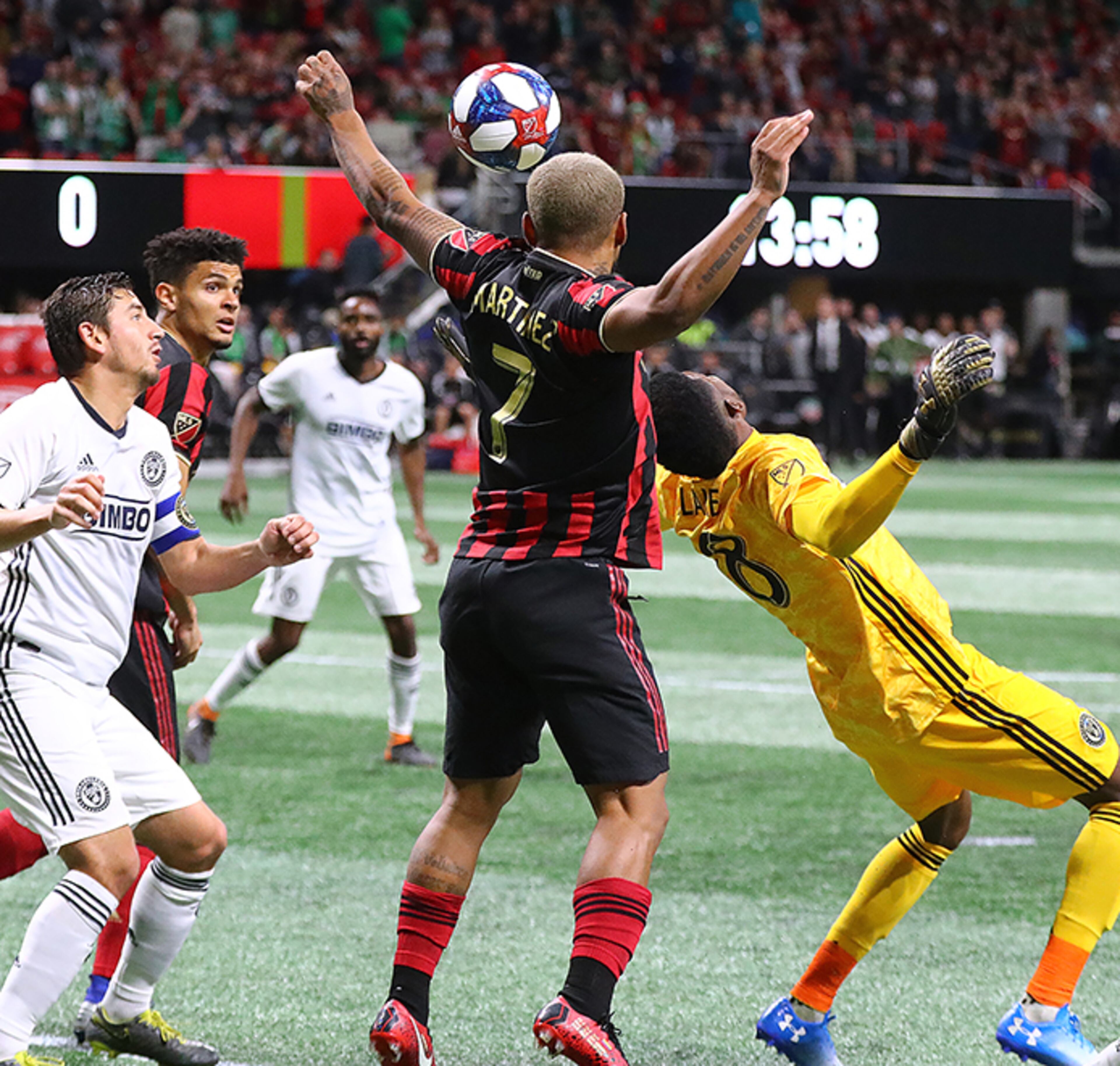 Atlanta United forward Josef Martinez collides with Philadelphia Union goalkeeper Andre Blake while trying to head a corner kick into the net during the first half Sunday, March 17, 2019, at Mercedes-Benz Stadium in Atlanta.