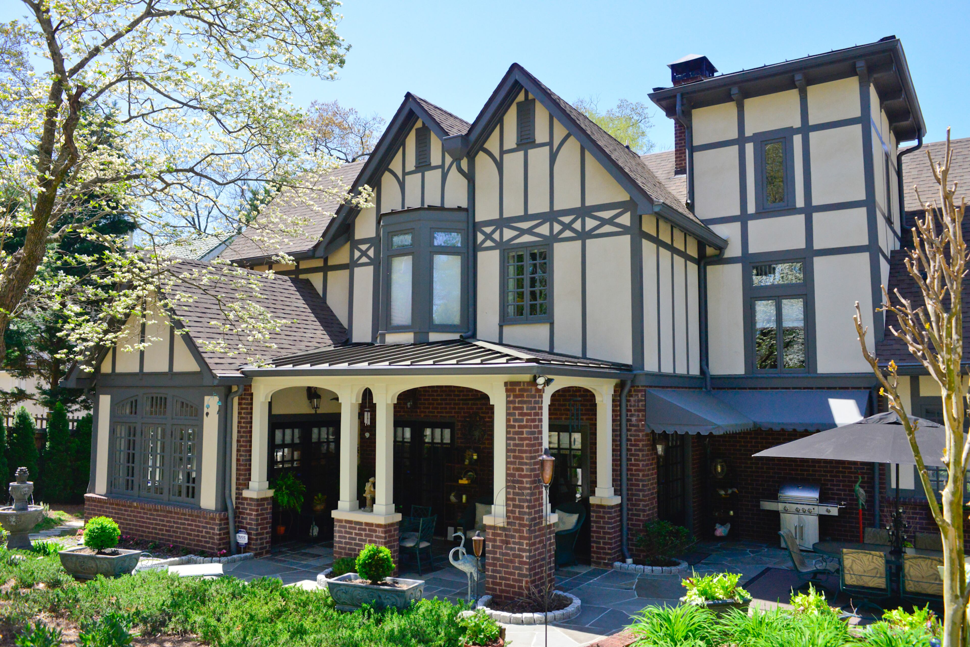 The 1.14-acre property gave the Boones the ability to expand the back of their Atlanta home, adding more than 1,650 square feet, and to grow their outdoor living space with a bluestone porch and patio. Frank Neely designed the rear porch French doors and the Gothic front and mud room doors. -- Text by Lori Johnston