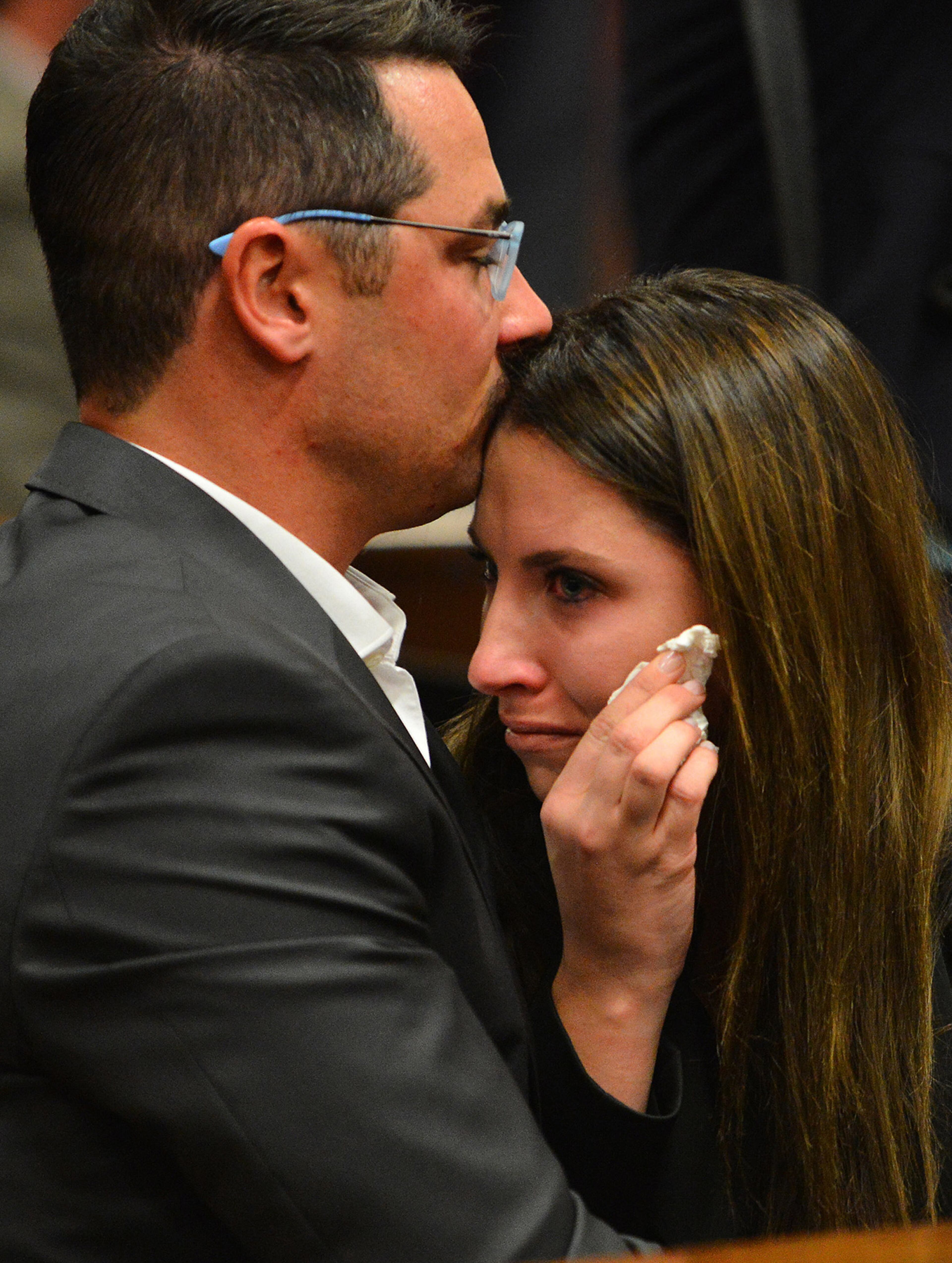 Oscar Pistorius' siblings Carl, left, and Aimee Pistorius, right, attend the ongoing murder trial of their brother in Pretoria, South Africa, Monday June 30, 2014. The trial resumed Monday, after one month during which mental health experts evaluated the athlete to determine if he has an anxiety disorder that could have influenced his actions on the night he killed girlfriend Reeva Steenkamp. (AP Photo/Phill Magakoe, Pool)