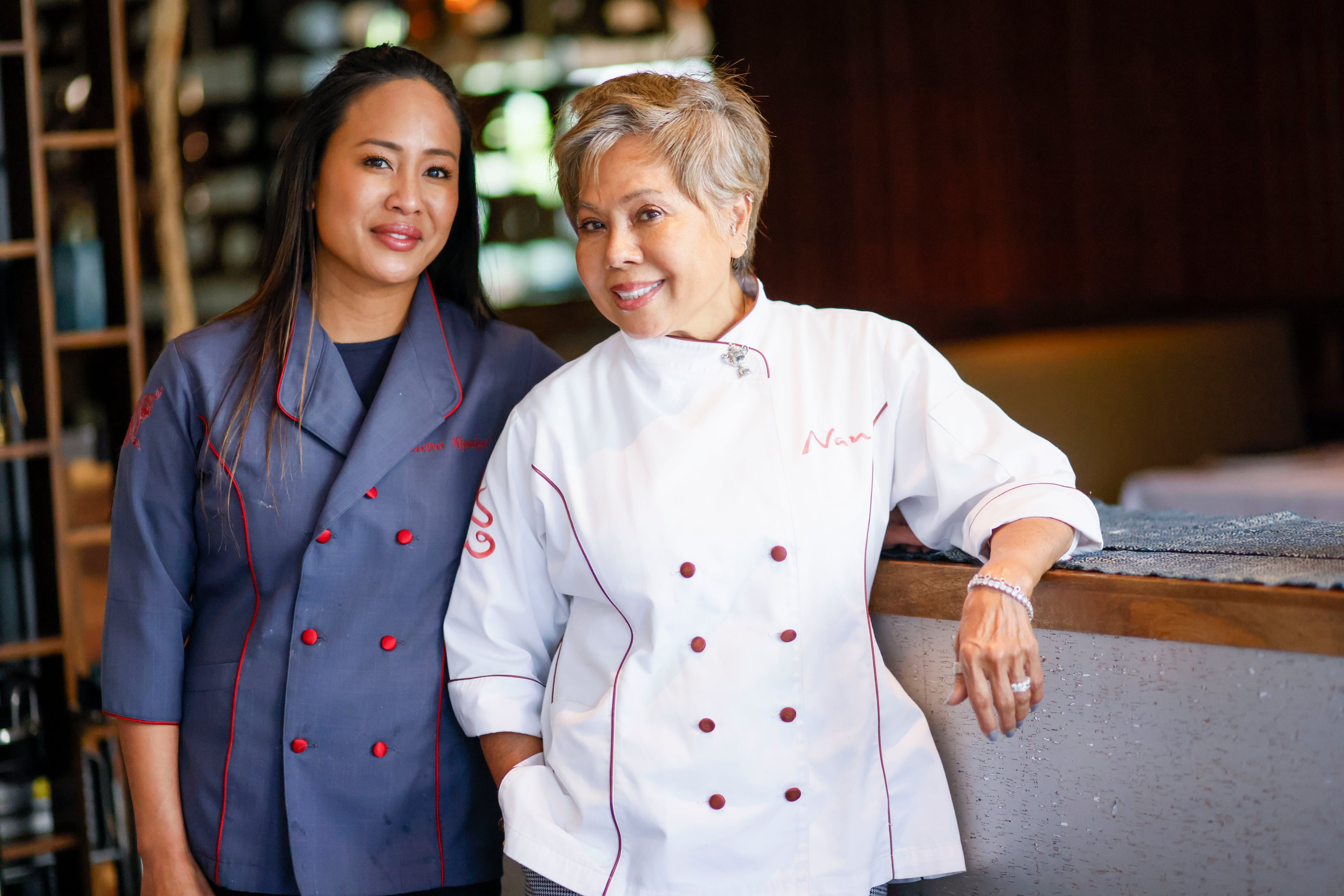 DeeDee Niyomkul and her mother, Nan Niyomkul, were photographed at Nan Thai Buckhead on Wednesday, April 16, 2025. Nan Niyomkul has established a multigenerational connection with Thai cuisine and shares her culinary expertise with DeeDee, who owns Tuk Tuk Thai Food Loft in Brookwood Hills and Nan Thai Buckhead. (Miguel Martinez/AJC)