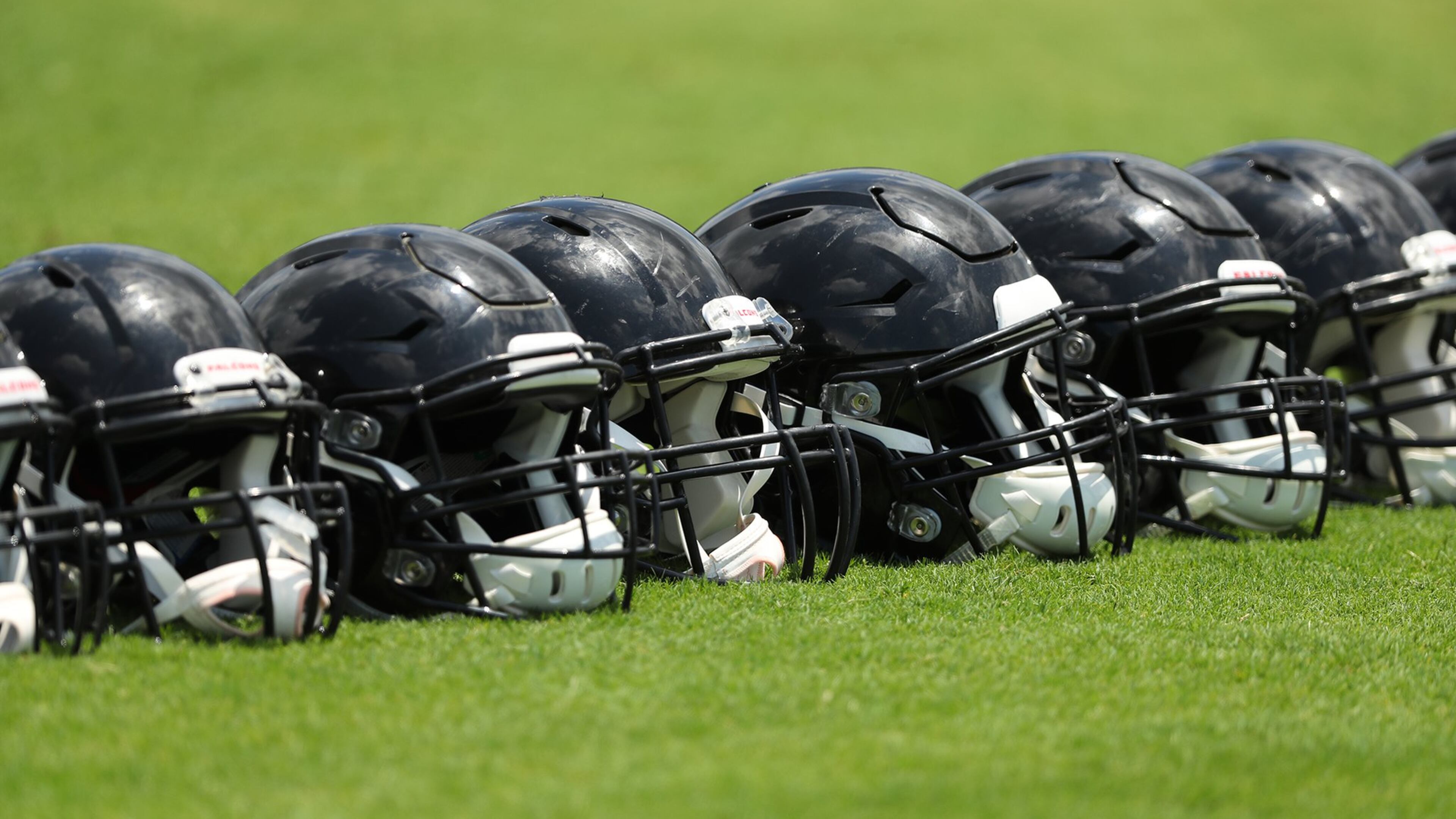 June 13, 2017, Flowery Branch: Falcons helmets line the field during the first day of mini-camp on Tuesday, June 13, 2017, in Flowery Branch. Curtis Compton/ccompton@ajc.com