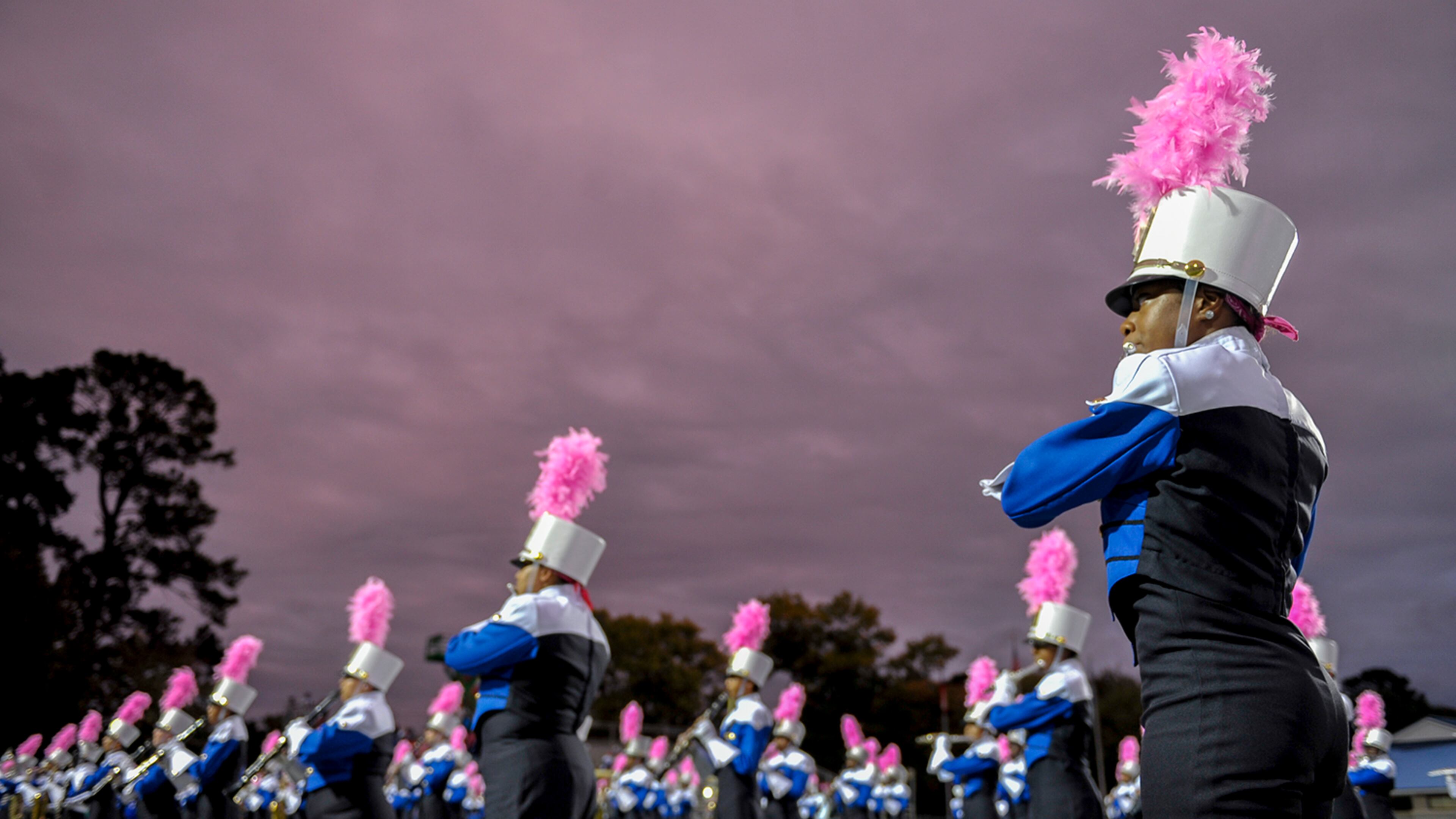 Members of the McEachern marching band perform the National Anthem prior to the start of a 2016 game.