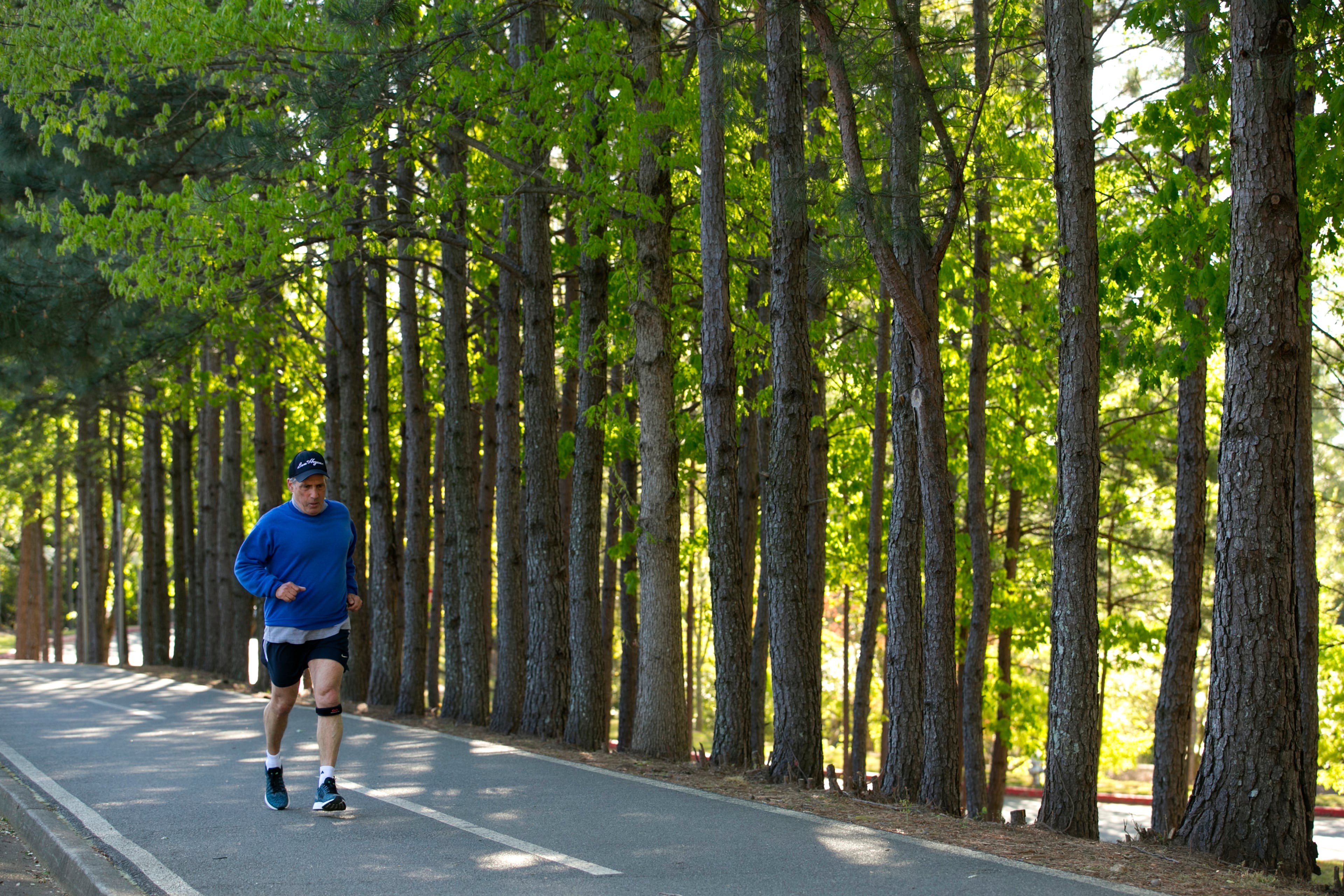 April 3, 2016 - Johns Creek, Ga: Alan Sanderson, of Johns Creek, jogs at the Newtown Park Sunday, April 3, 2016, in Johns Creek, Ga. This is for the insider's guide feature about the Newtown neighborhood. PHOTO / JASON GETZ