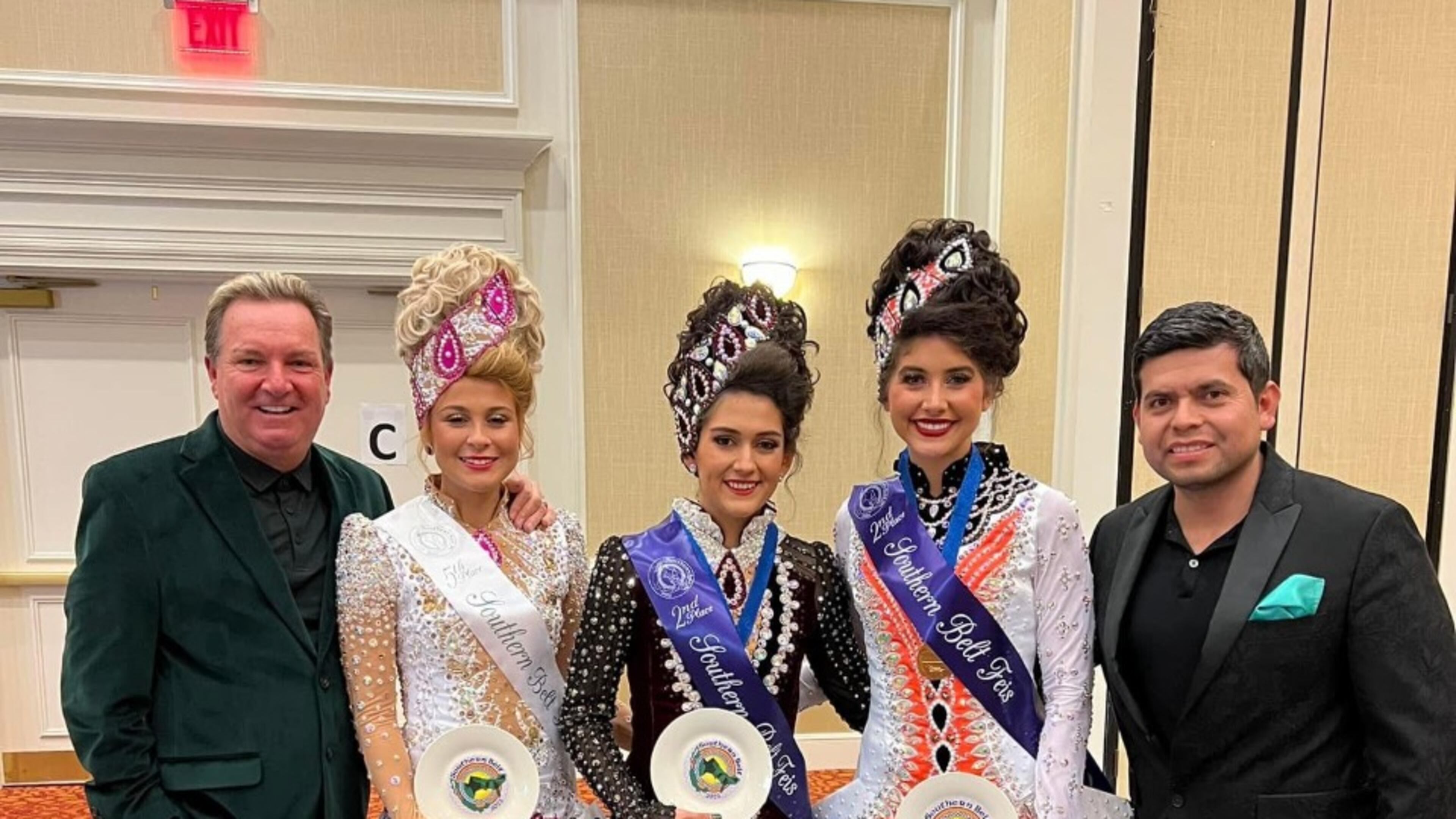 Karl Drake, founder of Drake School of Irish Dance, is shown here with three of his students who recently competed at Palmetto State Feis in Spartanburg, SC. The next stop for these 3 girls will be in Belfast for the upcoming World Championship of Irish Dancing. (Pictured L-R: Karl Drake, Danna Maki-Florida, Luisa Diaz-National champion from Drake Mexico, Ashlea DelFavero-Atlanta and Cesar Hernandez, husband of Drake).