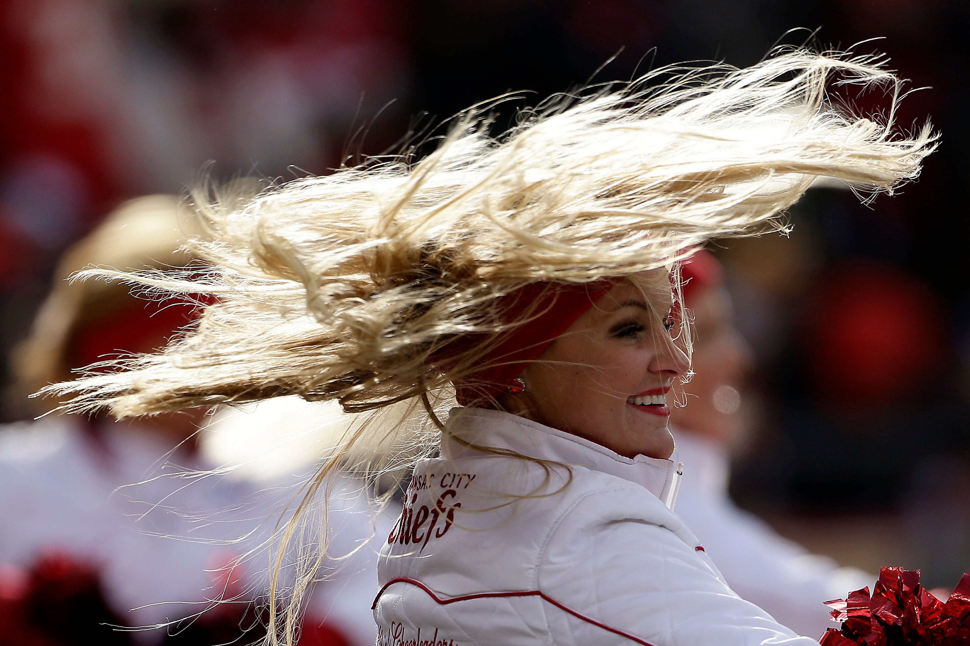 A Kansas City Chiefs cheerleader performs during the first half of an NFL football game against the San Diego Chargers Sunday, Nov. 24, 2013, in Kansas City, Mo. (AP Photo/Charlie Riedel)