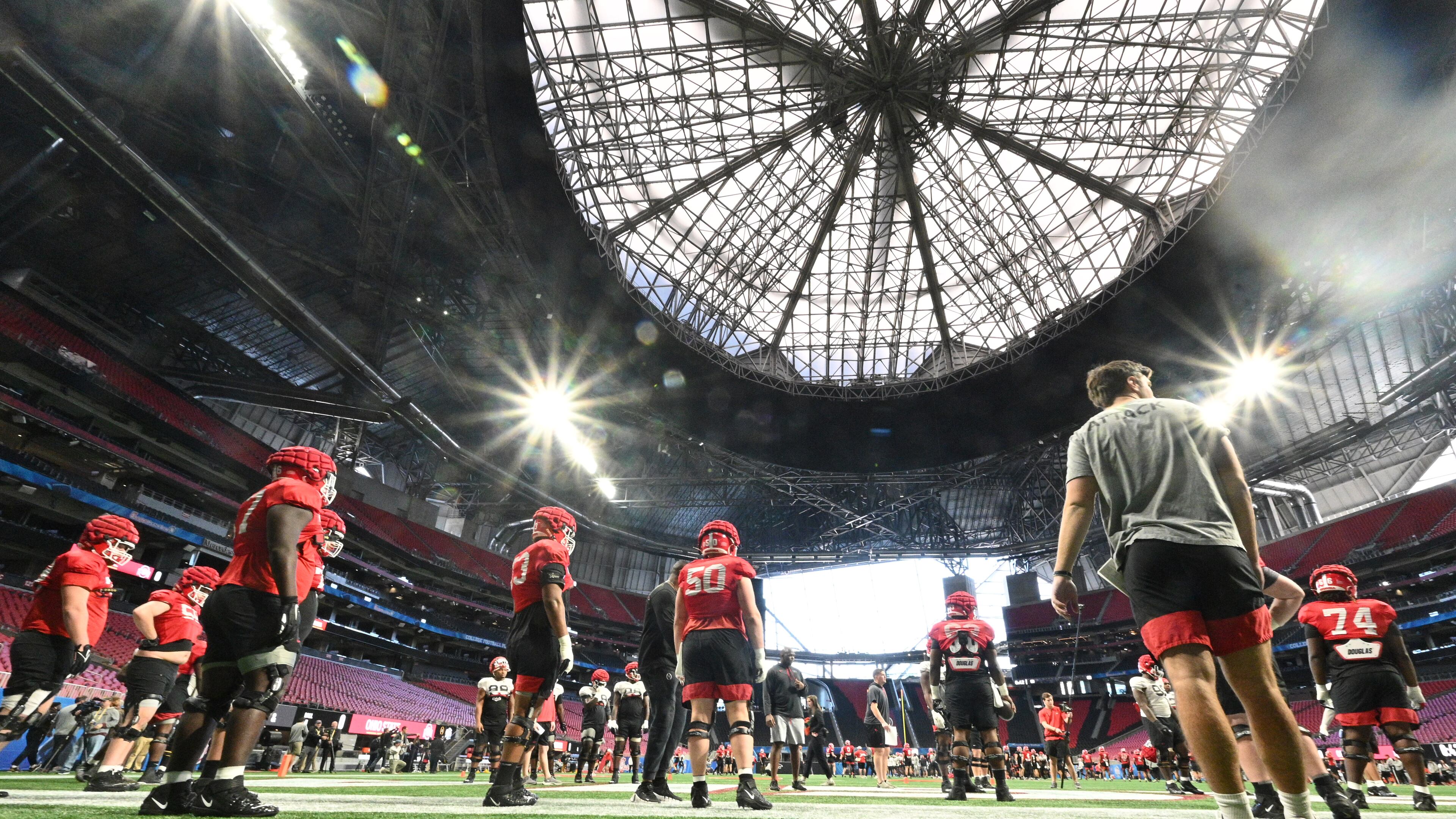 Georgia players run through drills during their practice session Wednesday at Mercedes-Benz Stadium ahead of the Chick-fil-A Peach Bowl against Ohio State. (Hyosub Shin / Hyosub.Shin@ajc.com)