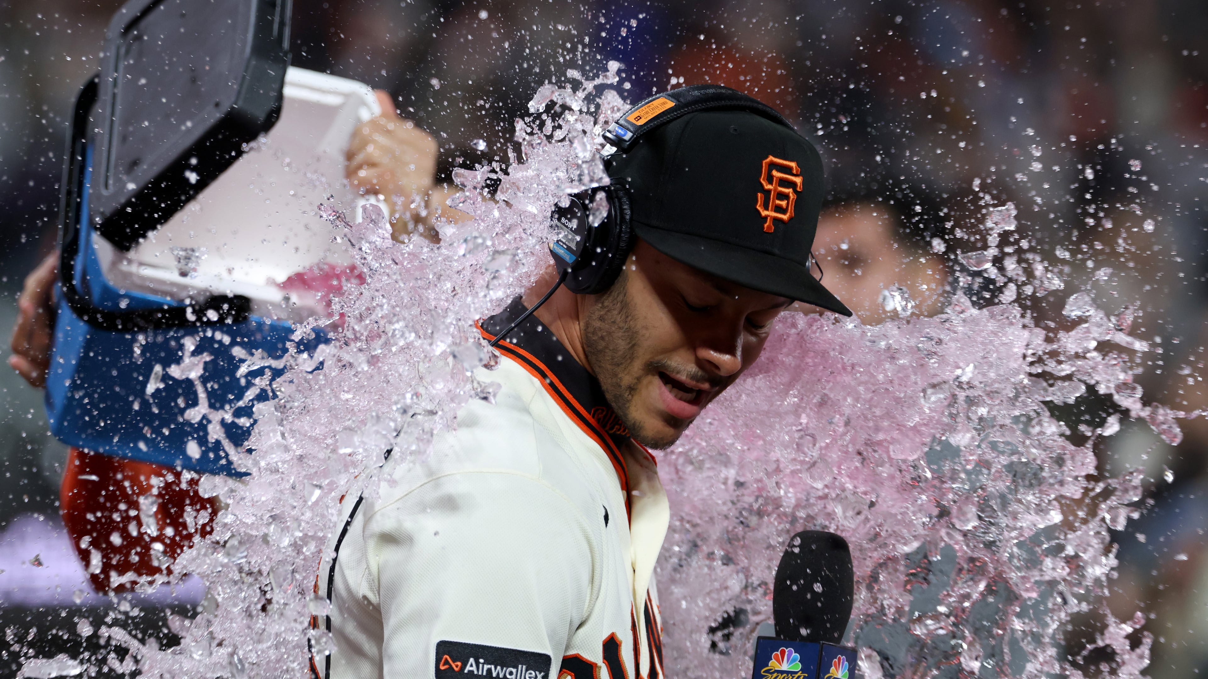 San Francisco Giants' Grant McCray is doused by teammates after their team's victory over the Milwaukee Brewers during a baseball game in San Francisco, Monday, July 27, 2026. (AP Photo/Jed Jacobsohn)