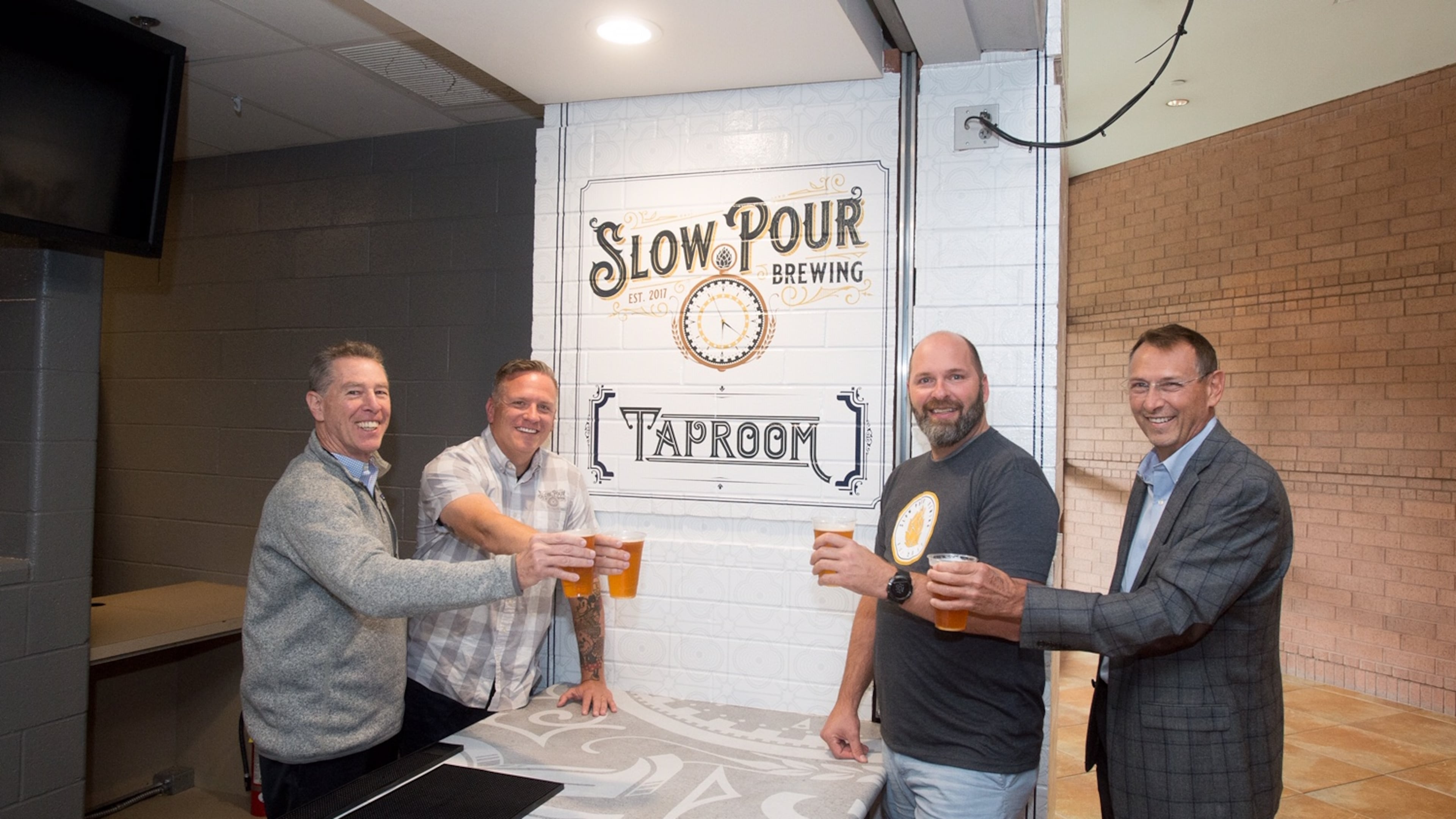 Slow Pour Brewing has opened a branded taproom in the Infinite Energy Arena as part of a new partnership with the Infinite Energy Center.