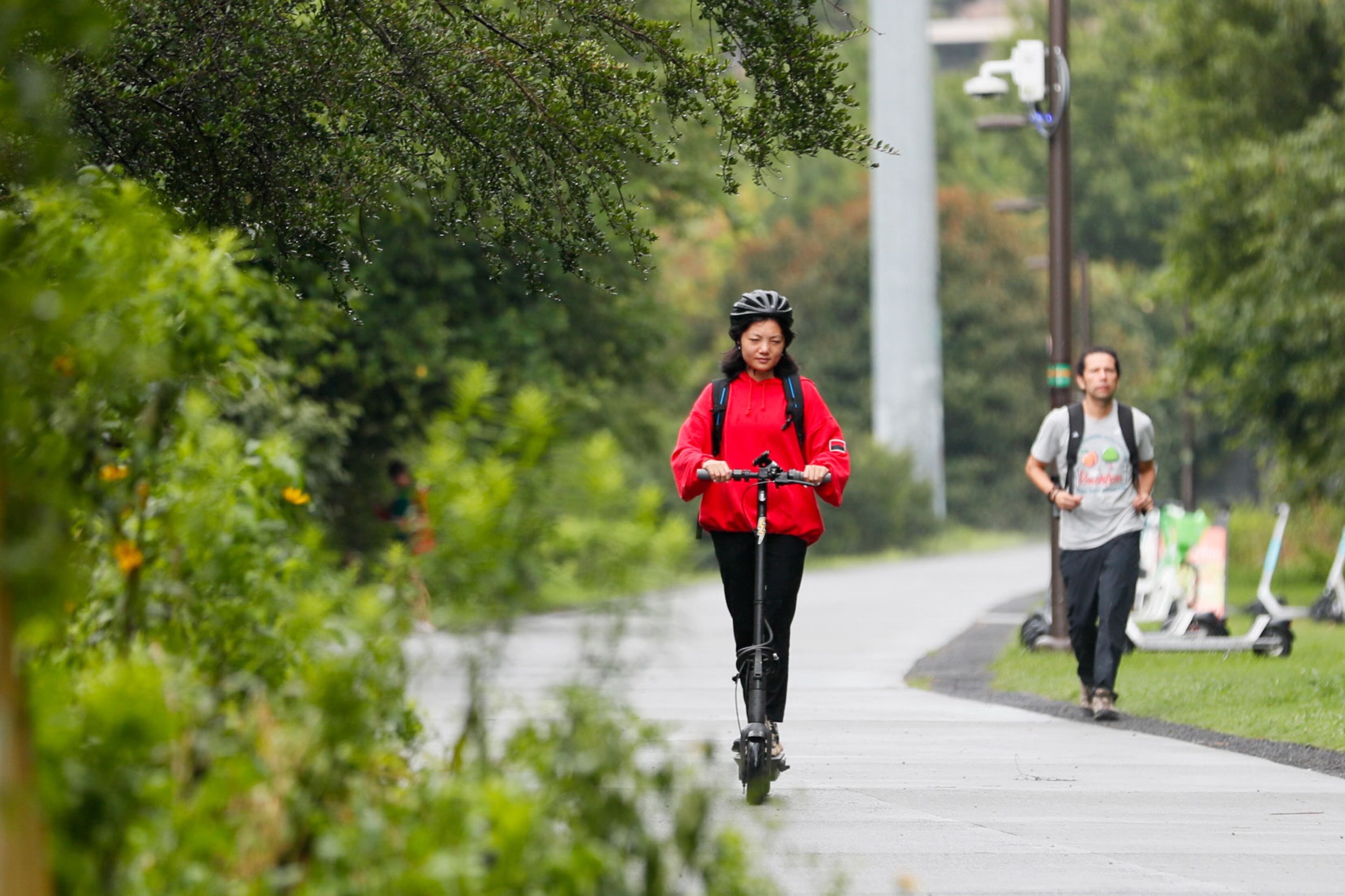 Mona Su, who lives in Midtown, was seen riding her scooter along the beltline on her way home on Monday, July 22, 2024. For Mona Su, riding scooters is a car-free lifestyle that provides an easy and reliable commuting alternative.
(Miguel Martinez / AJC)